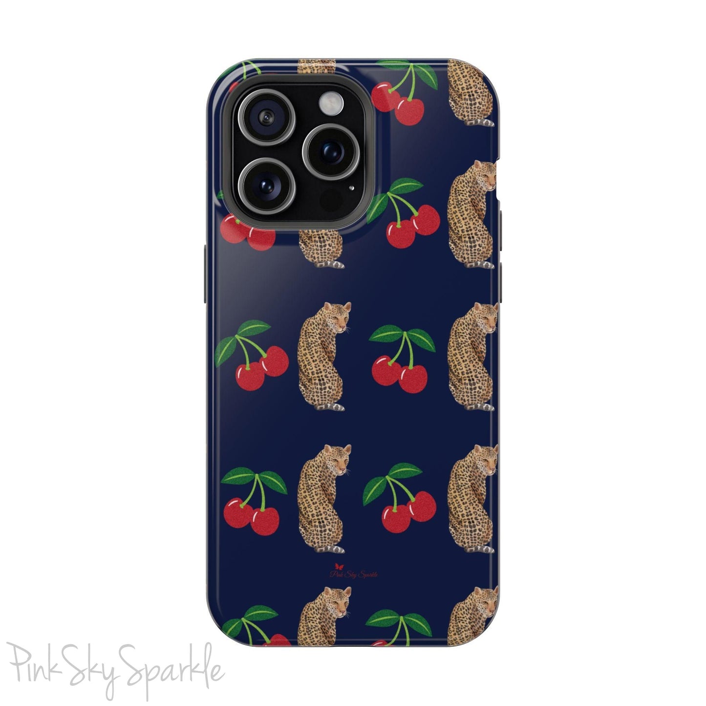 A stylish magnetic iPhone case featuring a unique pattern of leopards and bright red cherries on a dark navy blue background, blending bold and playful elements.