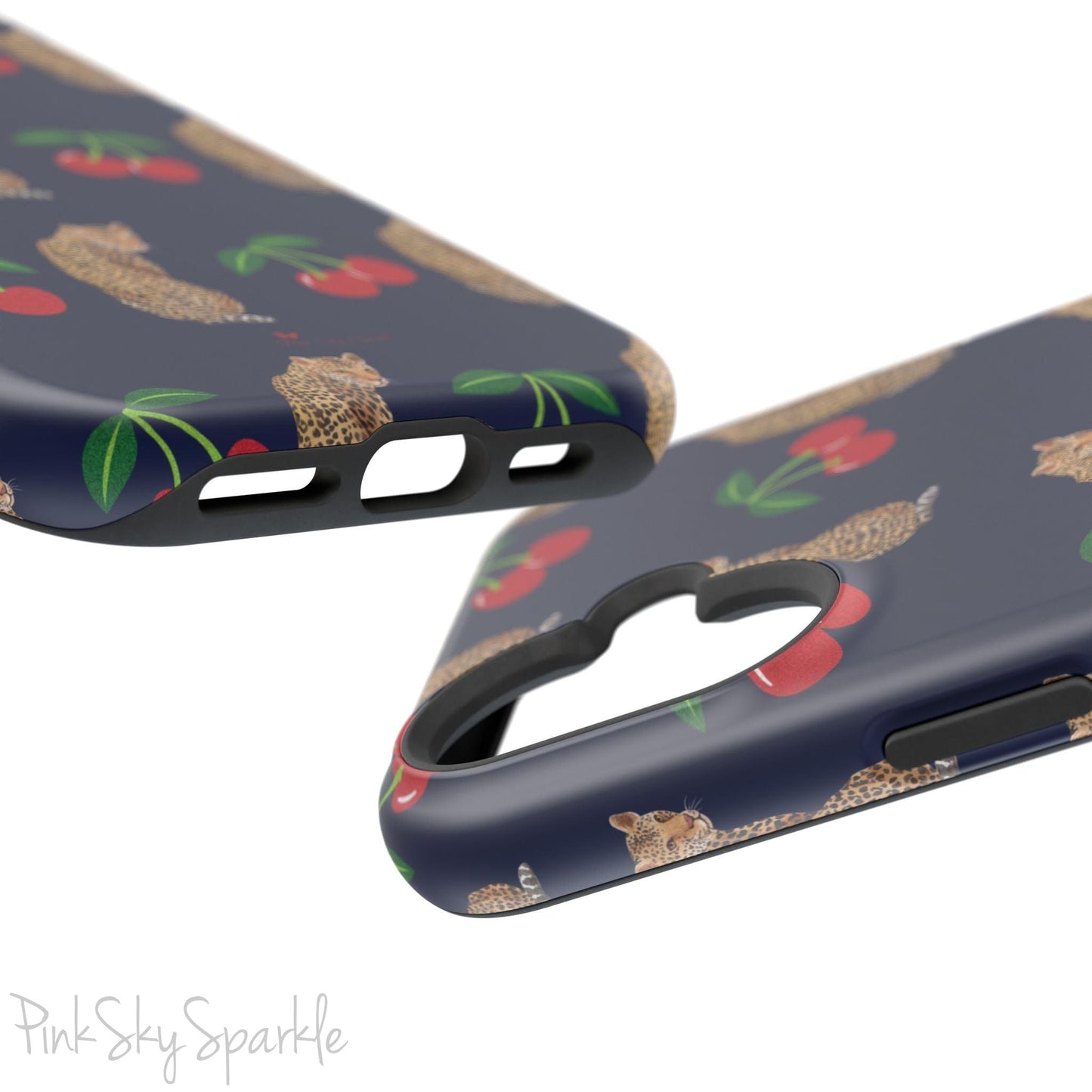 A stylish magnetic iPhone case featuring a unique pattern of leopards and bright red cherries on a dark navy blue background, blending bold and playful elements.