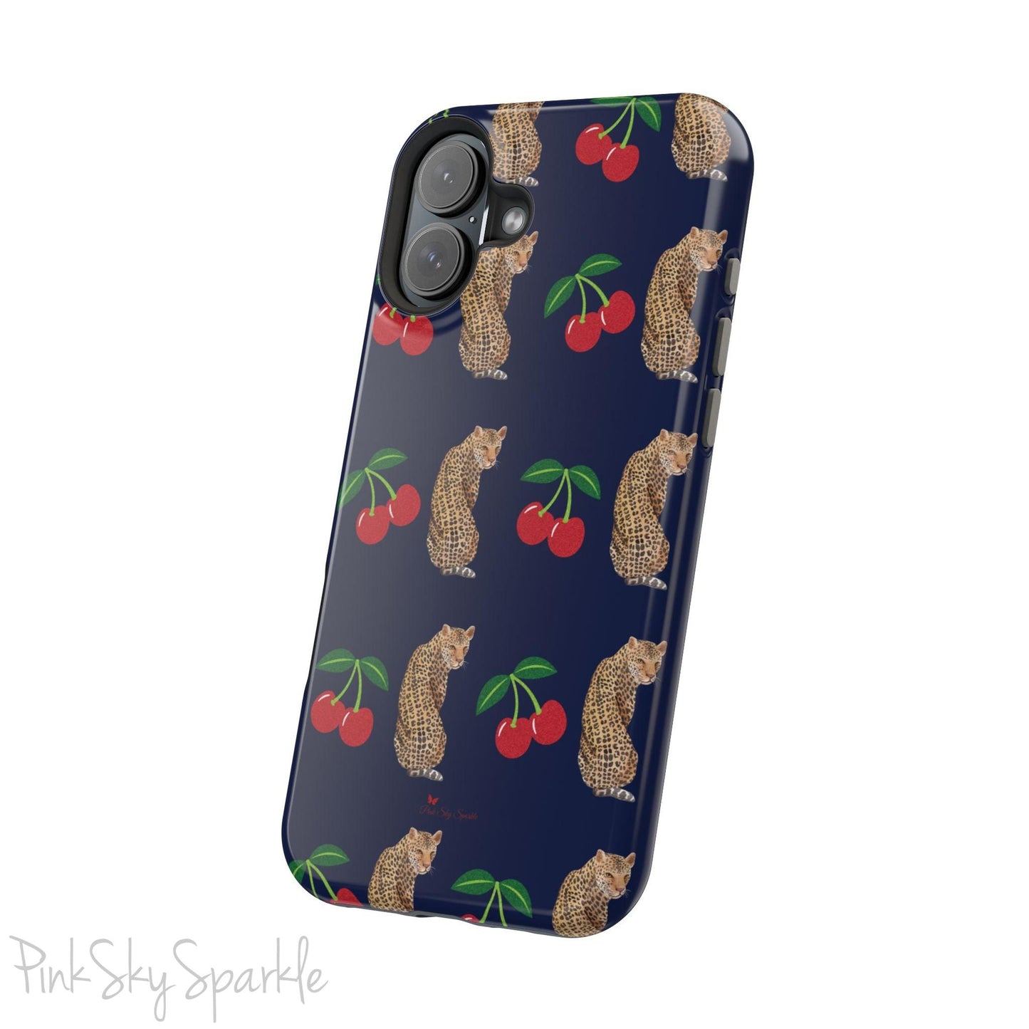 A stylish magnetic iPhone case featuring a unique pattern of leopards and bright red cherries on a dark navy blue background, blending bold and playful elements.