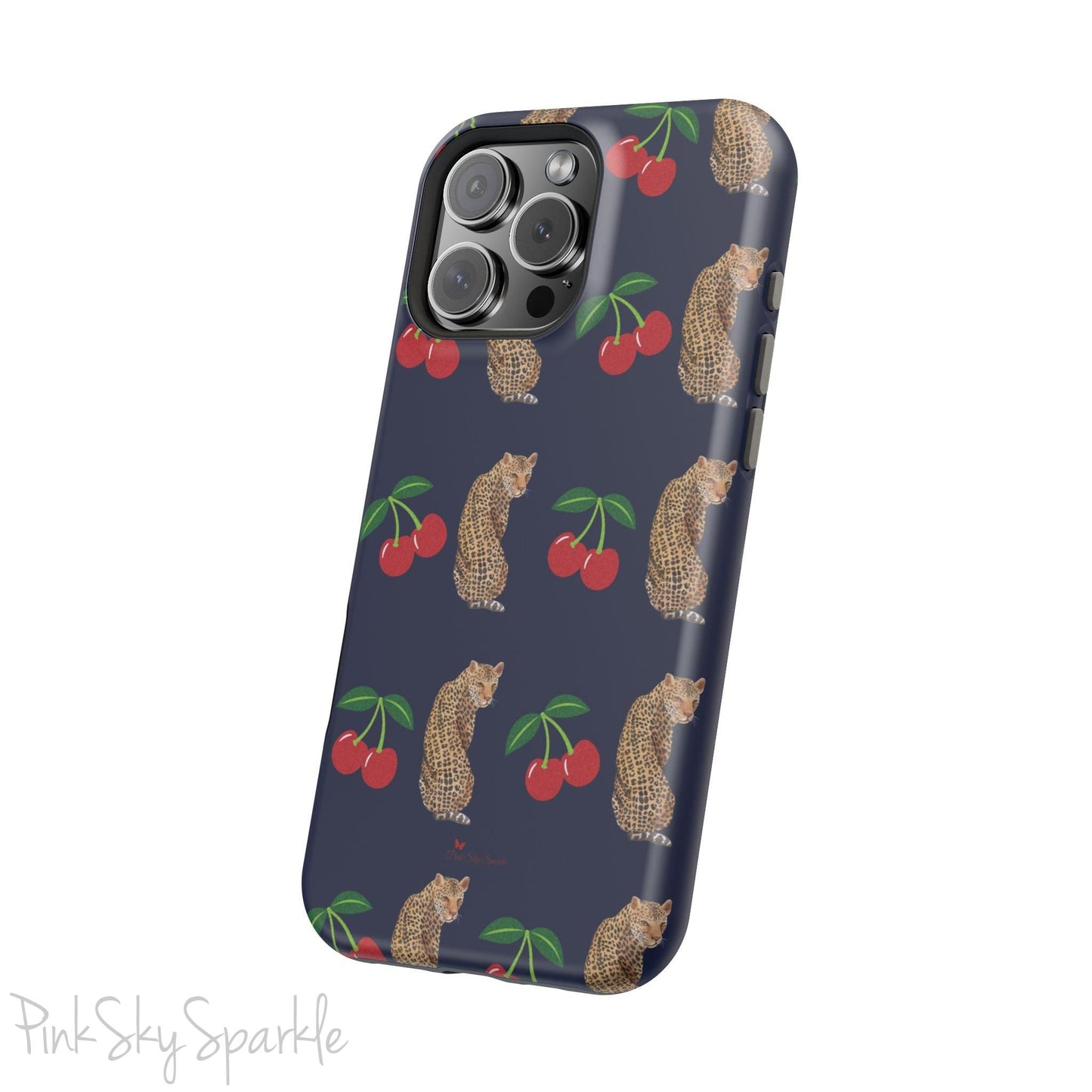 A stylish magnetic iPhone case featuring a unique pattern of leopards and bright red cherries on a dark navy blue background, blending bold and playful elements.