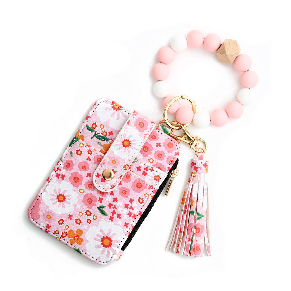 Floral wristlet card holder with beaded keychain, tassel, and zipper pocket – compact wallet for women