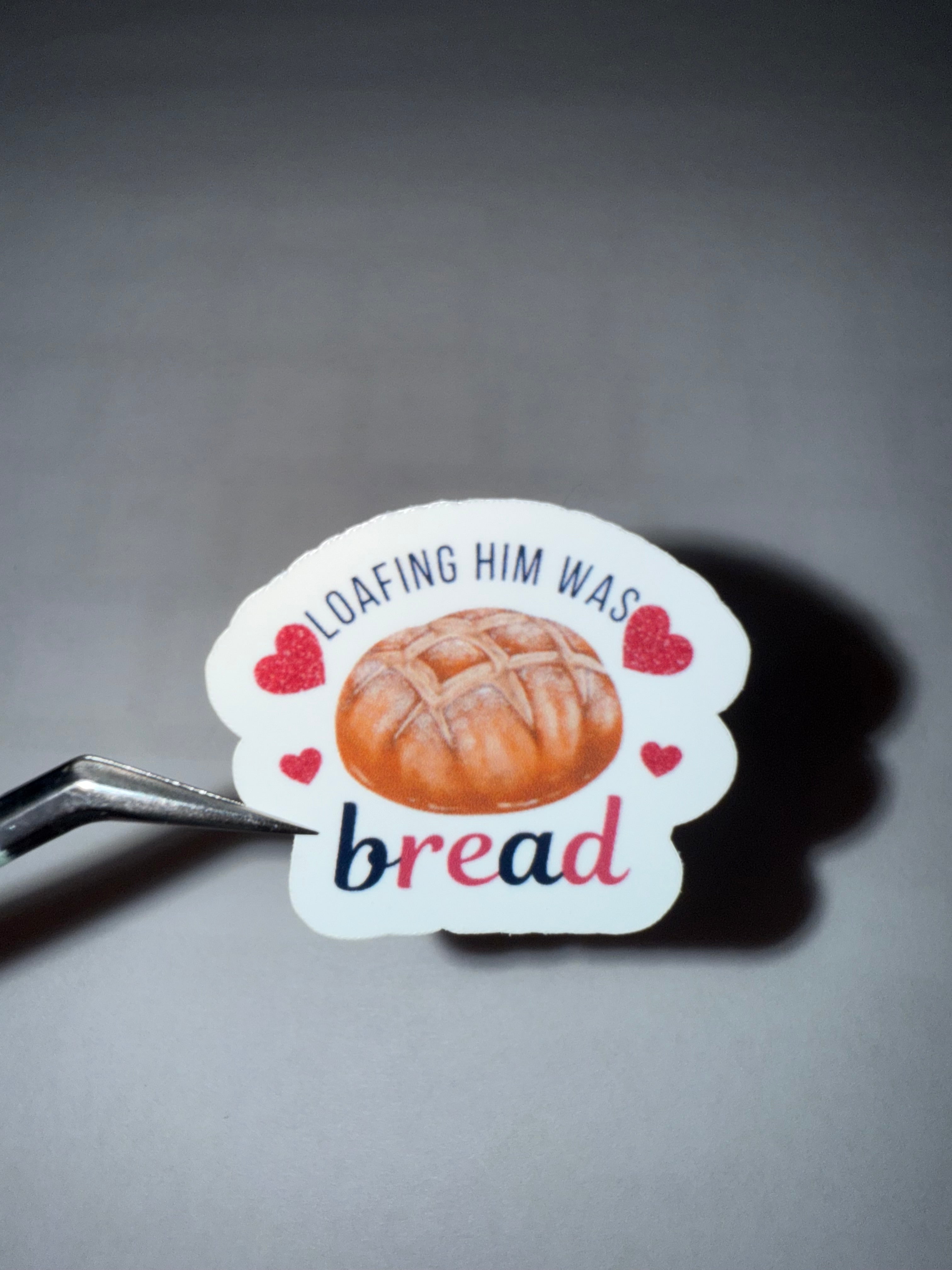 Sticker with sourdough bread loaf and the pun "loafing him was bread"