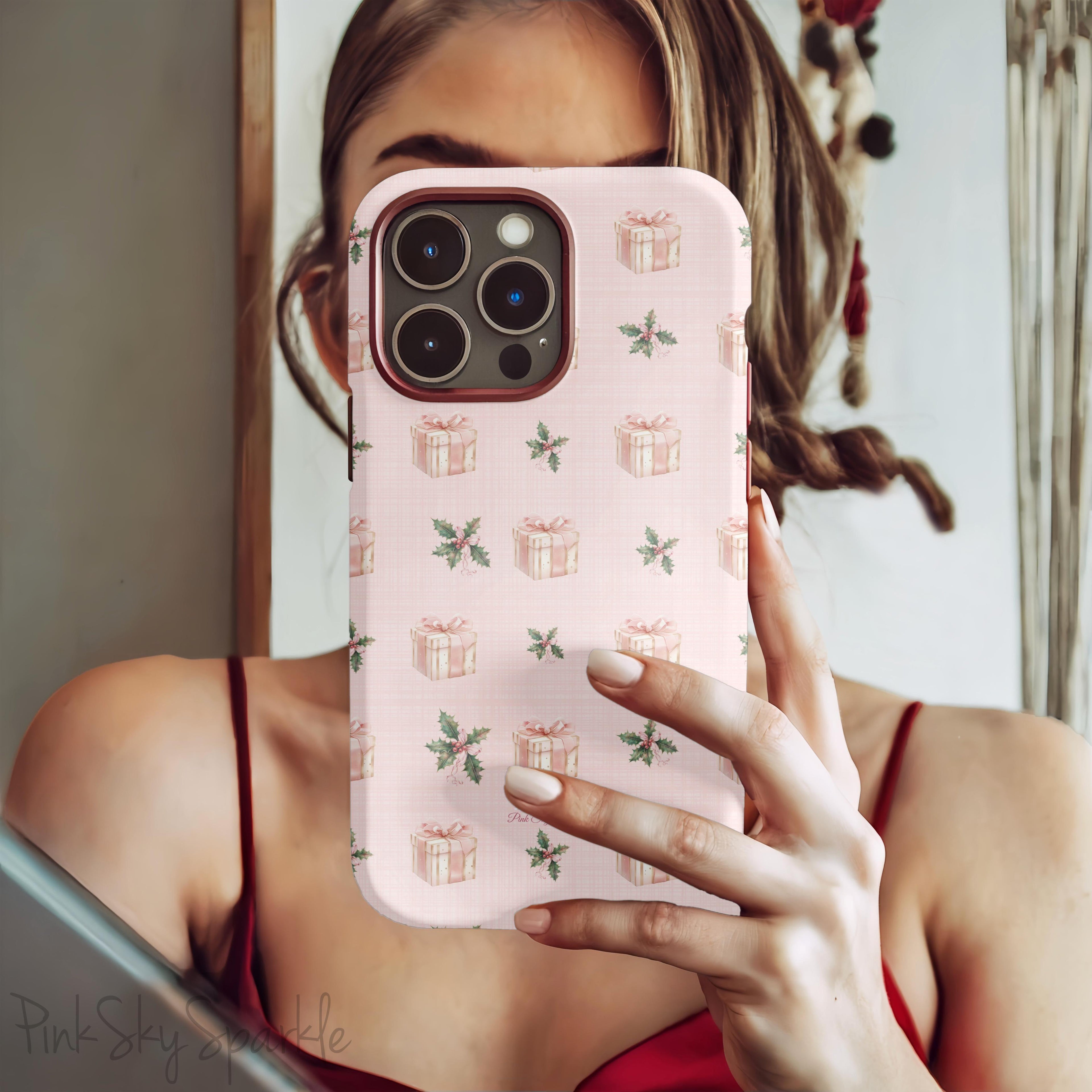Celebrate the season with the Pink Holly Jolly Magnetic iPhone Case. Featuring festive holly and gift designs in a pink palette, this case combines holiday cheer with durable protection. Perfect for iPhone models 13, 14, 15, and 16.