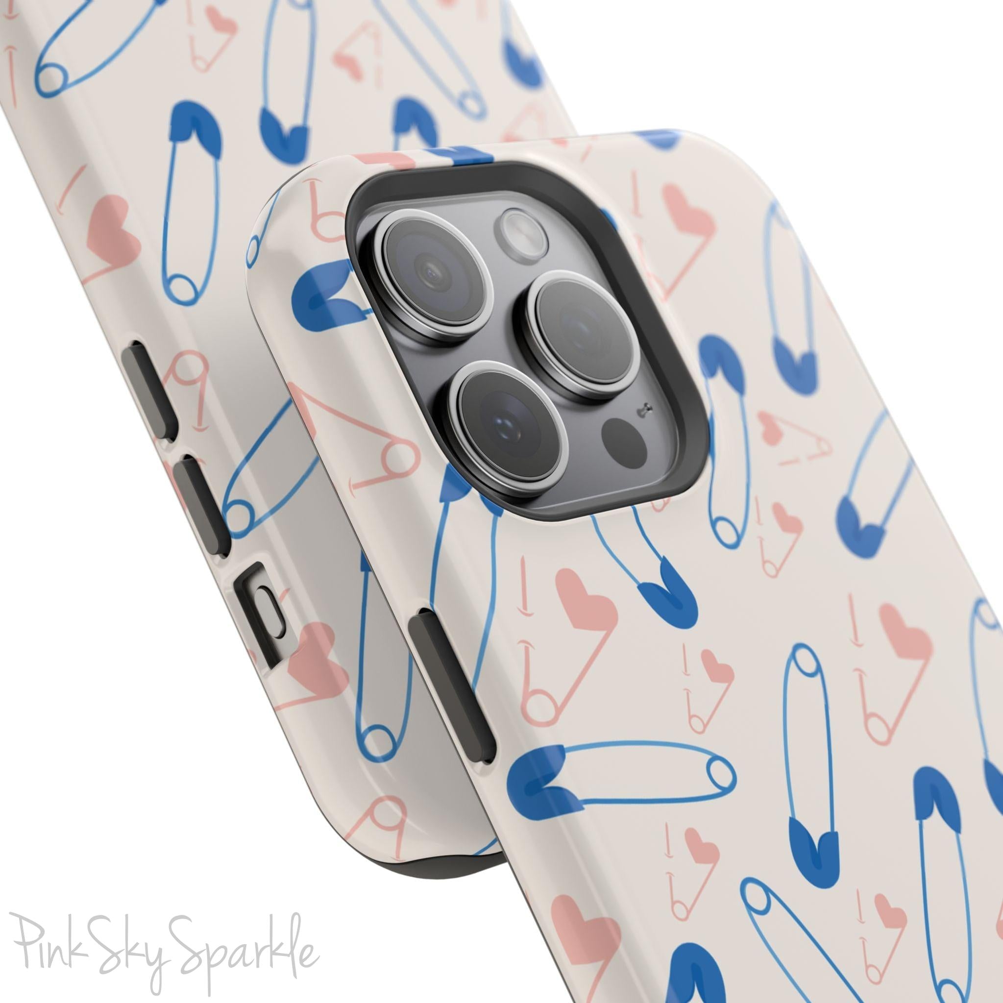 Make a statement with the Safety Pin Magnetic iPhone Case. Featuring a sleek design of blue safety pins, this case adds unique flair while providing durable protection for iPhone models 13, 14, 15, and 16.