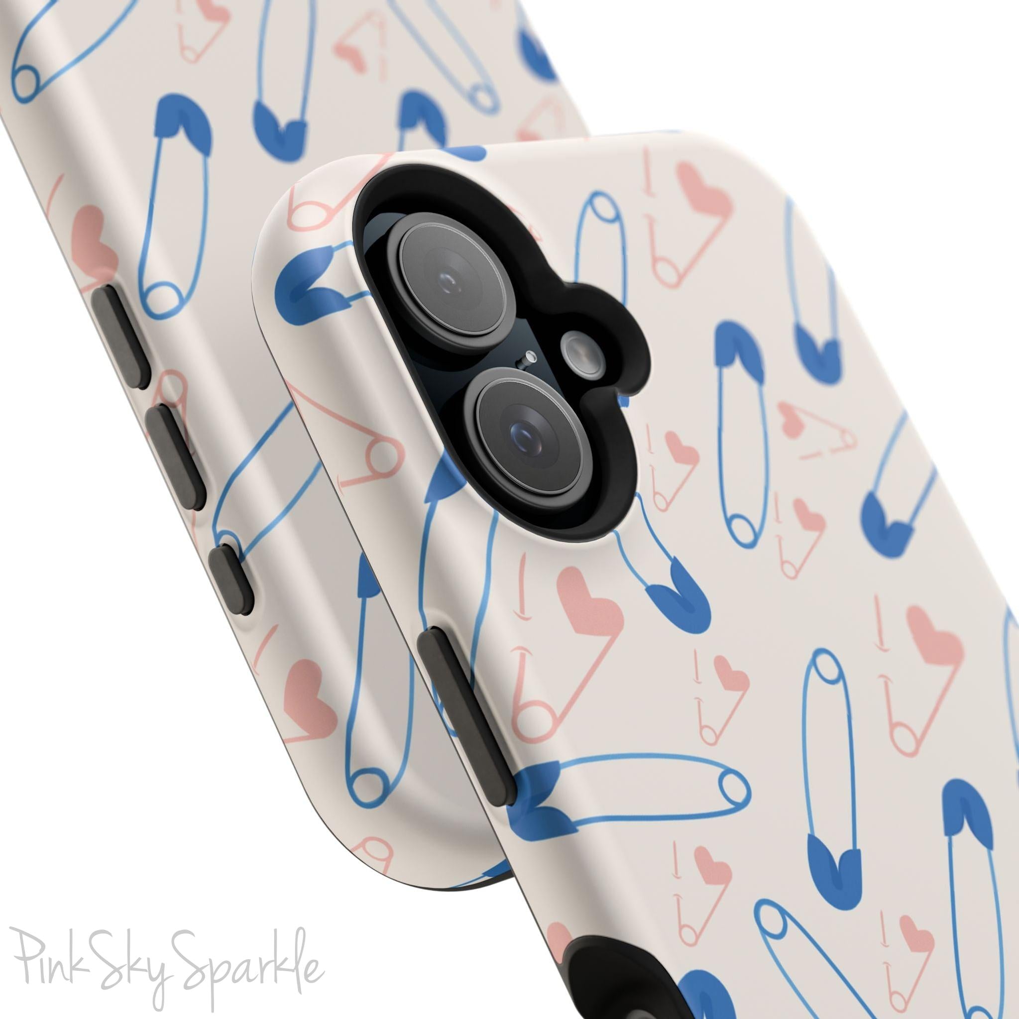 Make a statement with the Safety Pin Magnetic iPhone Case. Featuring a sleek design of blue safety pins, this case adds unique flair while providing durable protection for iPhone models 13, 14, 15, and 16.