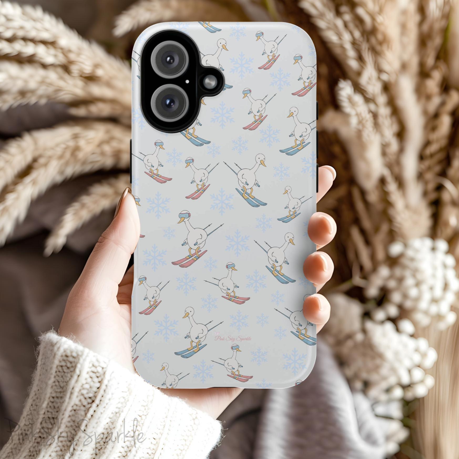 Silly Goose Magnetic iPhone Case. A whimsical iPhone case with a white background featuring illustrated geese skiing