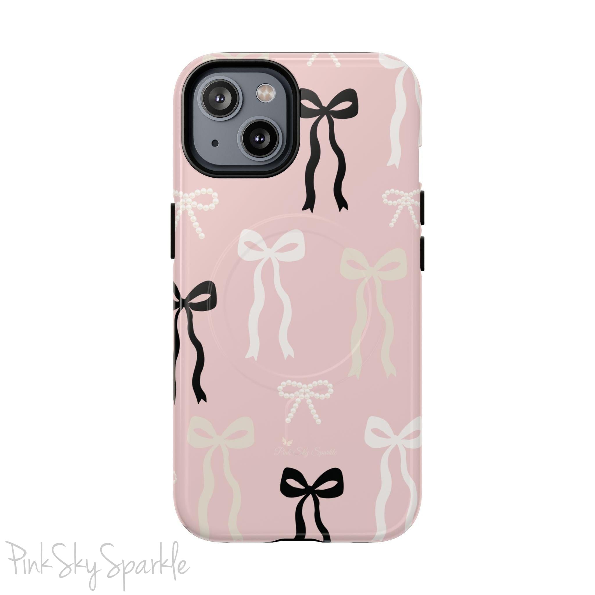 Pink magnetic iPhone case featuring an elegant bow pattern with black, white, and cream bows, designed for MagSafe® compatibility and premium protection.