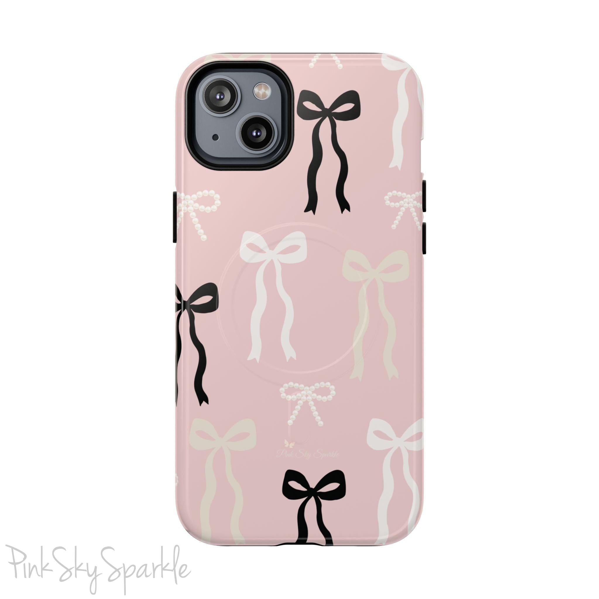 Pink magnetic iPhone case featuring an elegant bow pattern with black, white, and cream bows, designed for MagSafe® compatibility and premium protection.