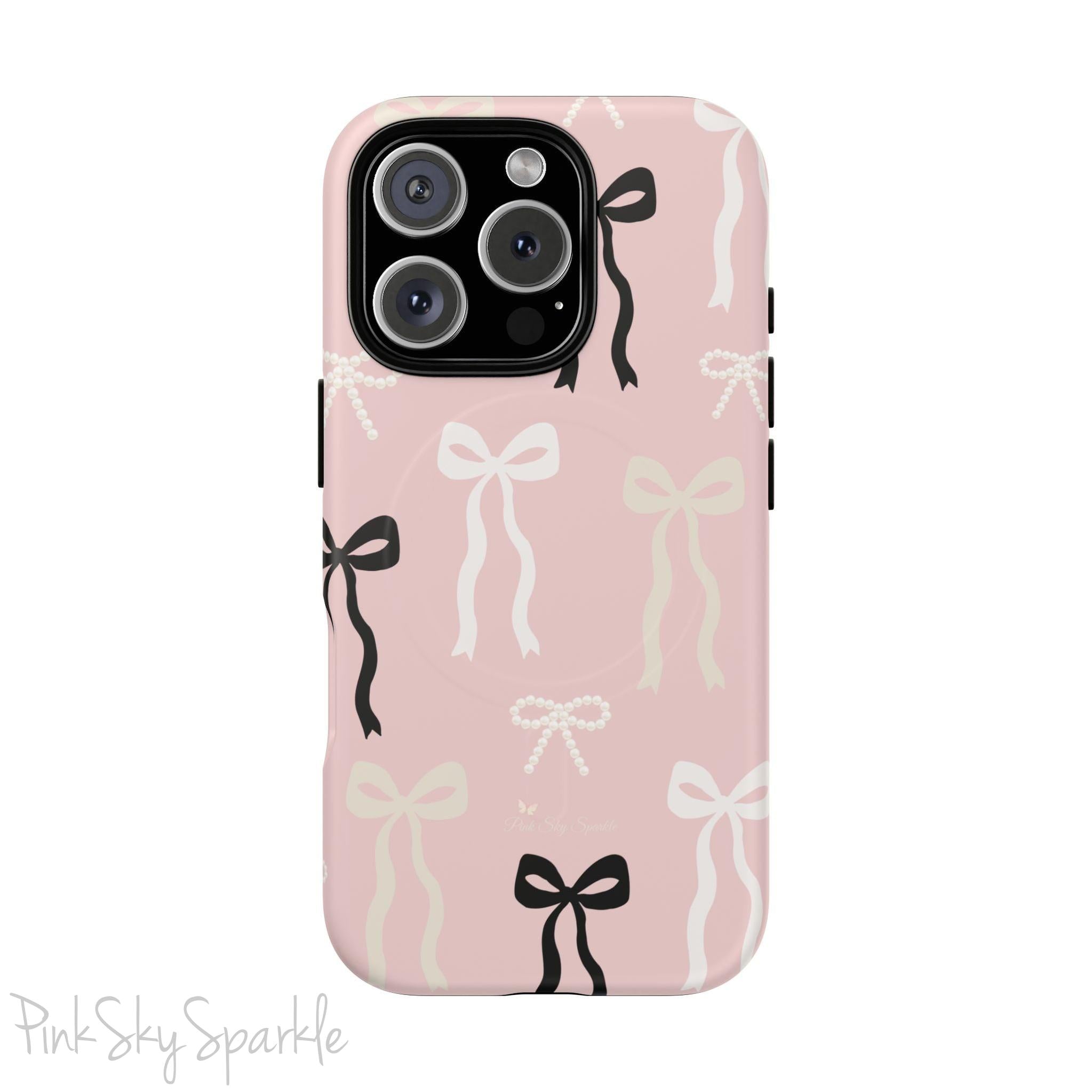 Pink magnetic iPhone case featuring an elegant bow pattern with black, white, and cream bows, designed for MagSafe® compatibility and premium protection.