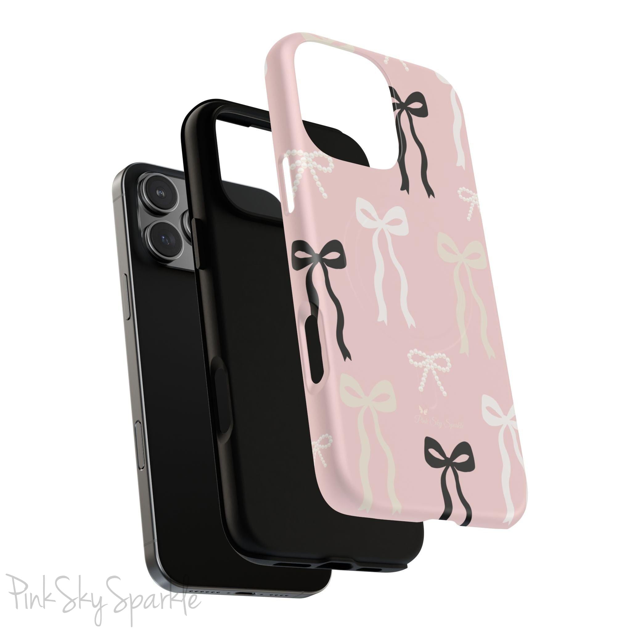 Pink magnetic iPhone case featuring an elegant bow pattern with black, white, and cream bows, designed for MagSafe® compatibility and premium protection.