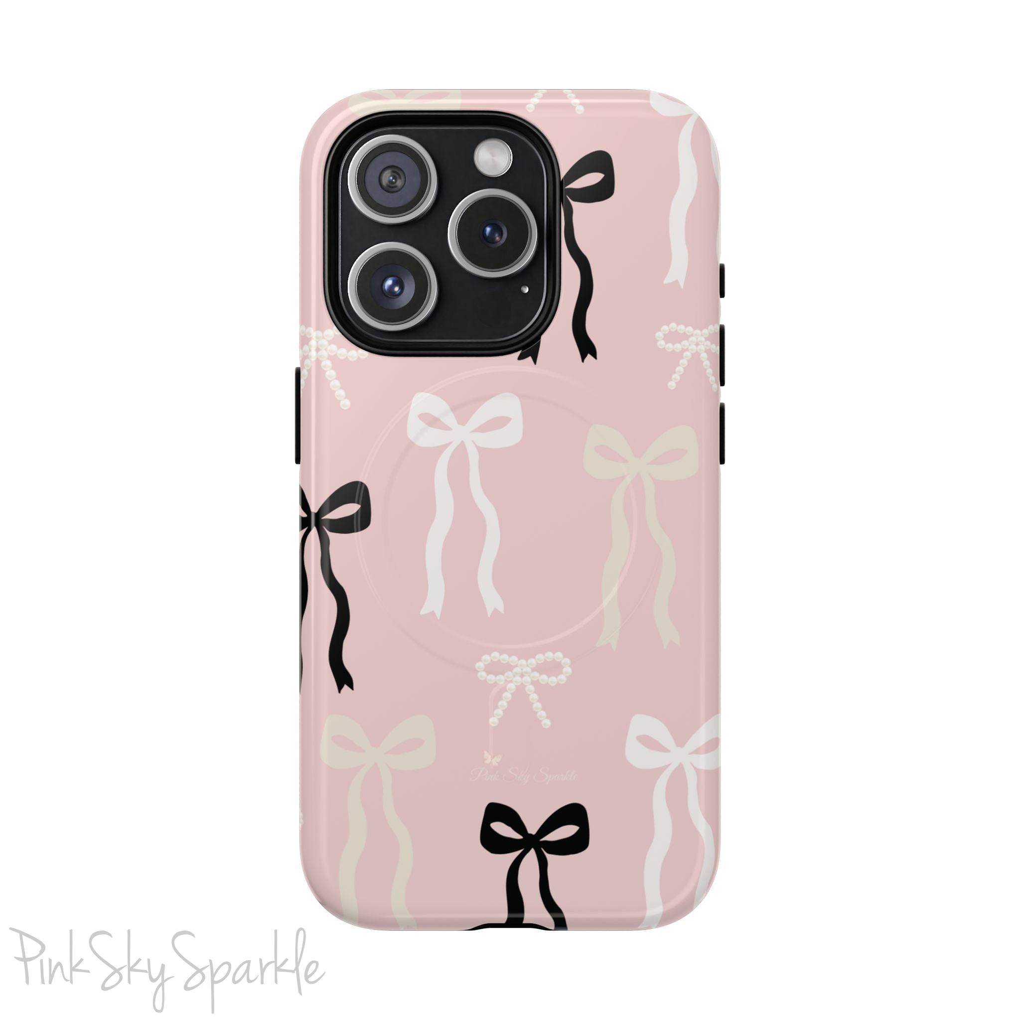 Pink magnetic iPhone case featuring an elegant bow pattern with black, white, and cream bows, designed for MagSafe® compatibility and premium protection.