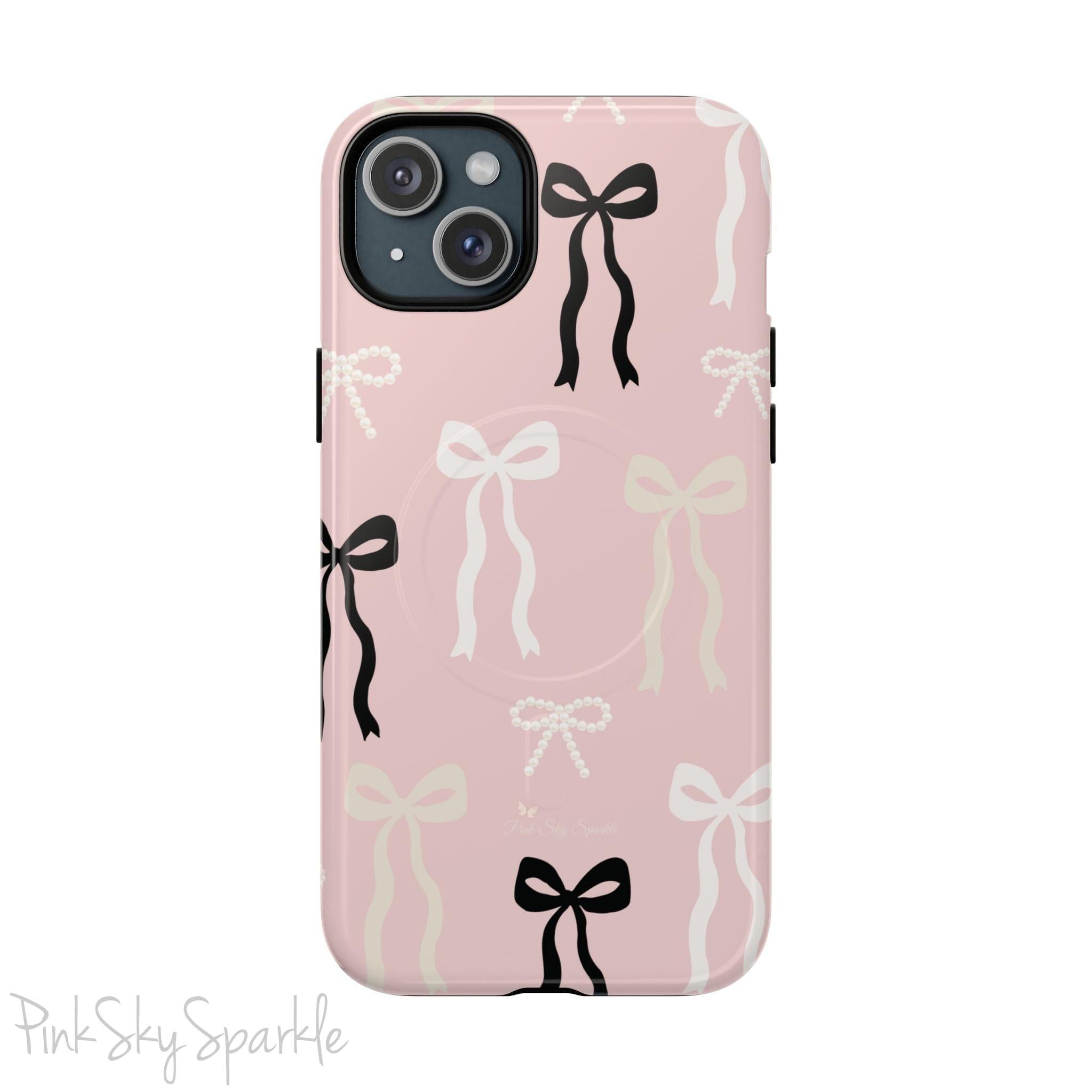Pink magnetic iPhone case featuring an elegant bow pattern with black, white, and cream bows, designed for MagSafe® compatibility and premium protection.