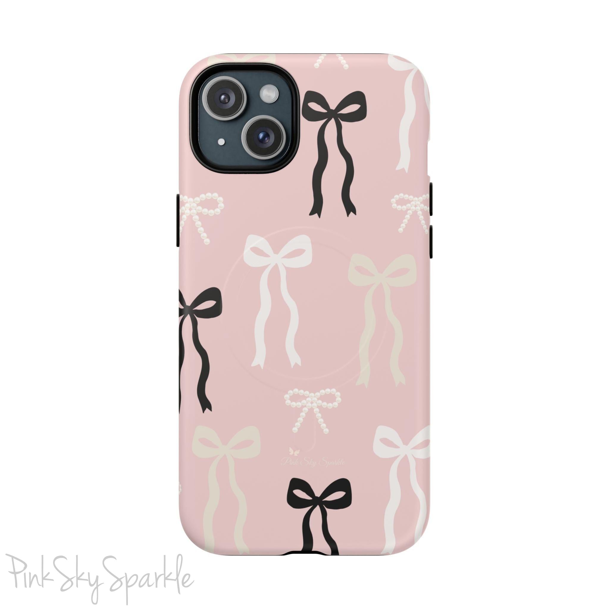 Pink magnetic iPhone case featuring an elegant bow pattern with black, white, and cream bows, designed for MagSafe® compatibility and premium protection.