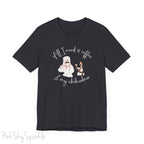 "All I need is coffee and my chihuahua" T-shirt. Featuring a graphic of a woman wearing a robe and hair towel, wearing black sunglasses drinking a coffee next to a chihuahua wearing black sunglasses.