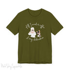 "All I need is coffee and my chihuahua" T-shirt. Featuring a graphic of a woman wearing a robe and hair towel, wearing black sunglasses drinking a coffee next to a chihuahua wearing black sunglasses.