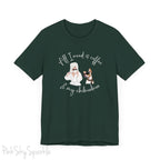 "All I need is coffee and my chihuahua" T-shirt. Featuring a graphic of a woman wearing a robe and hair towel, wearing black sunglasses drinking a coffee next to a chihuahua wearing black sunglasses.