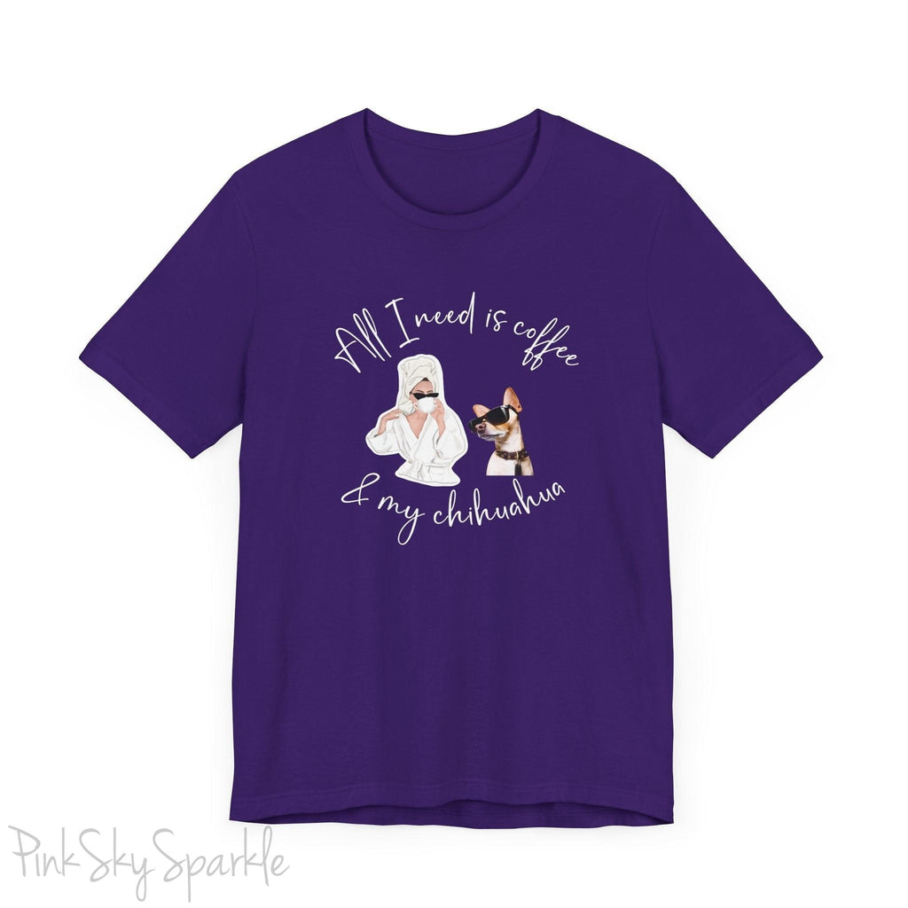"All I need is coffee and my chihuahua" T-shirt. Featuring a graphic of a woman wearing a robe and hair towel, wearing black sunglasses drinking a coffee next to a chihuahua wearing black sunglasses.