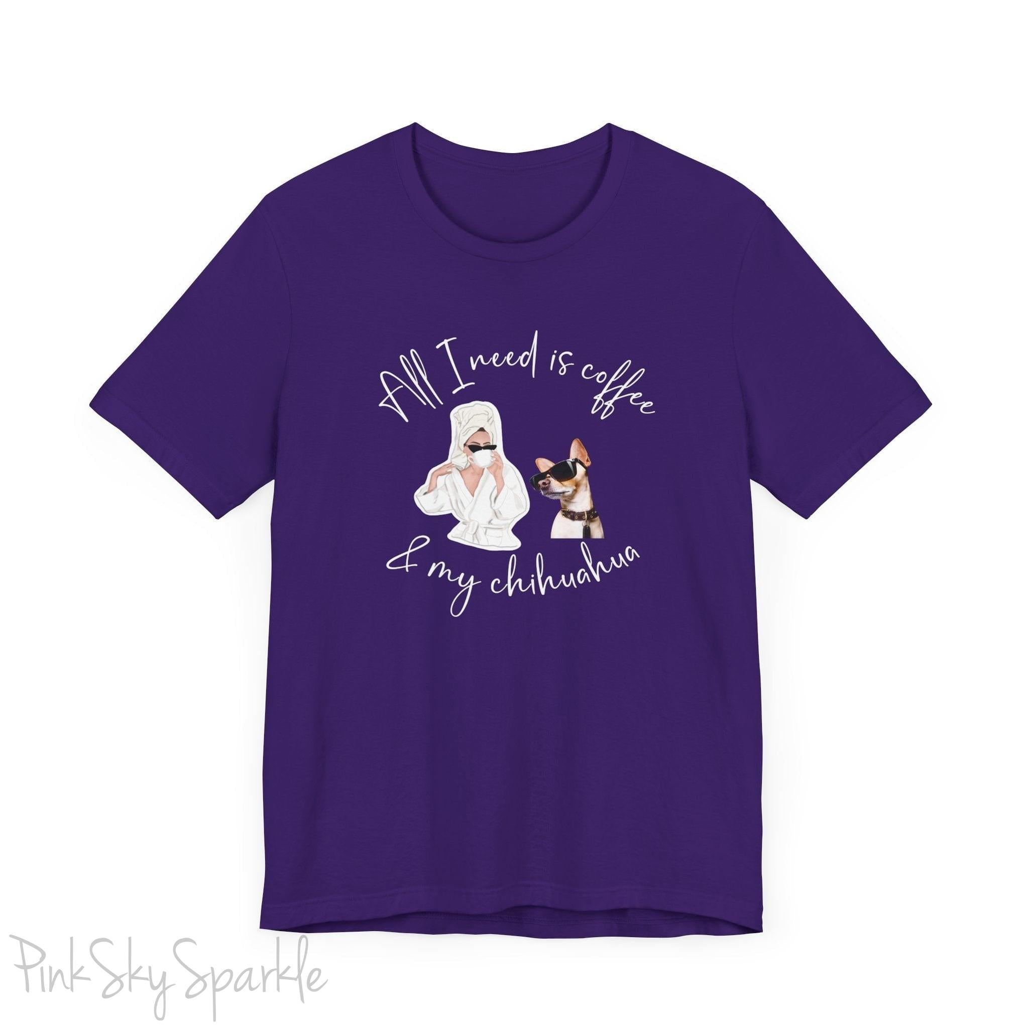 "All I need is coffee and my chihuahua" T-shirt. Featuring a graphic of a woman wearing a robe and hair towel, wearing black sunglasses drinking a coffee next to a chihuahua wearing black sunglasses.