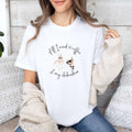 "All I need is coffee and my chihuahua" T-shirt. Featuring a graphic of a woman wearing a robe and hair towel, wearing black sunglasses drinking a coffee next to a chihuahua wearing black sunglasses.