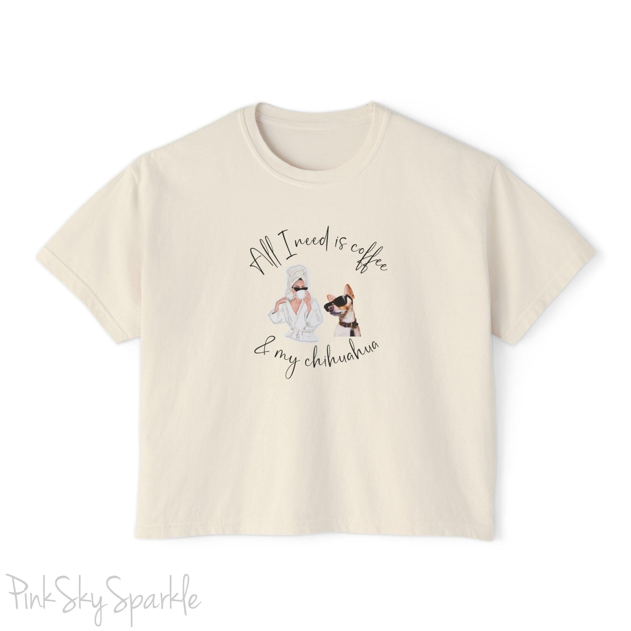"All I need is coffee and my chihuahua" Women's Boxy Tee. Featuring a graphic of a woman wearing a robe and hair towel, wearing black sunglasses drinking a coffee next to a chihuahua wearing black sunglasses.