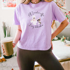 "All I need is coffee and my chihuahua" Women's Boxy Tee. Featuring a graphic of a woman wearing a robe and hair towel, wearing black sunglasses drinking a coffee next to a chihuahua wearing black sunglasses.