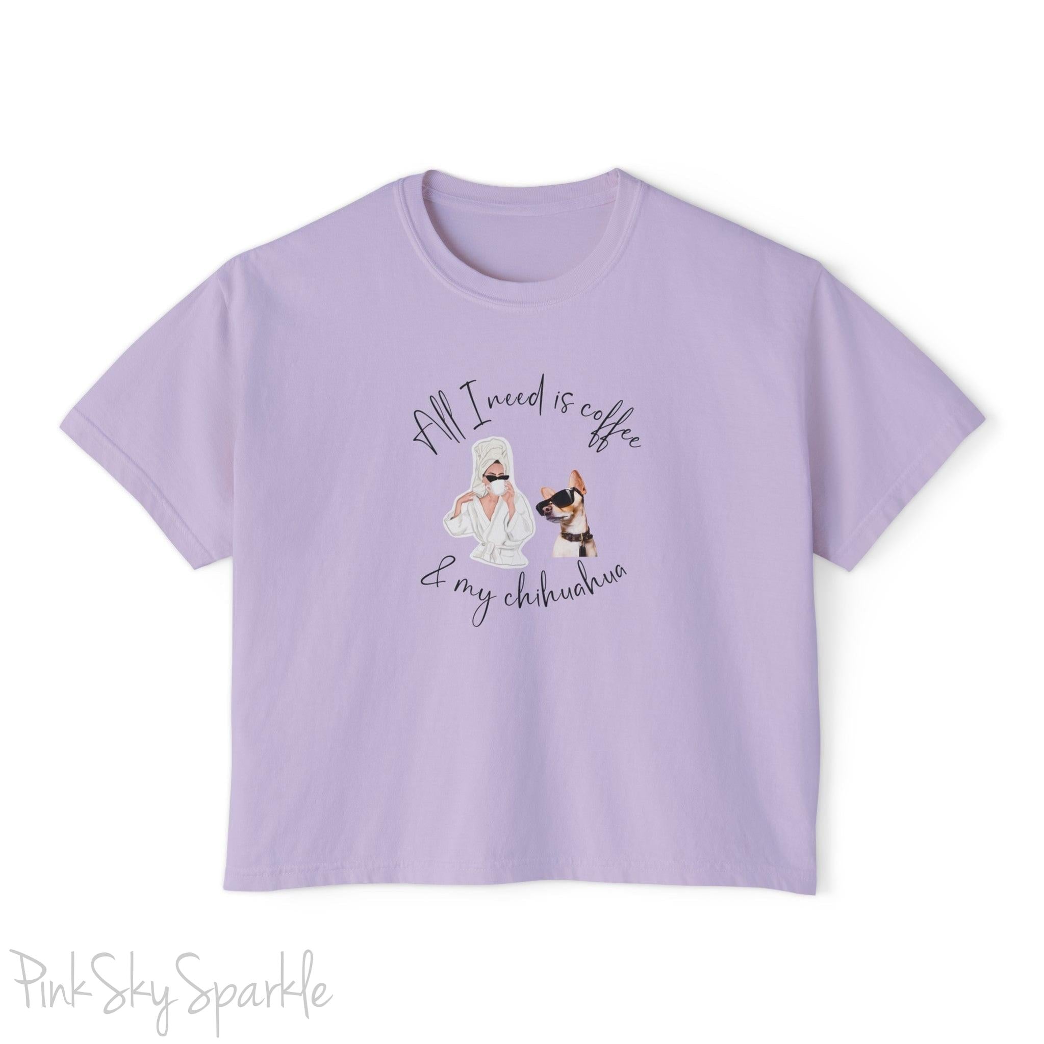 "All I need is coffee and my chihuahua" Women's Boxy Tee. Featuring a graphic of a woman wearing a robe and hair towel, wearing black sunglasses drinking a coffee next to a chihuahua wearing black sunglasses.