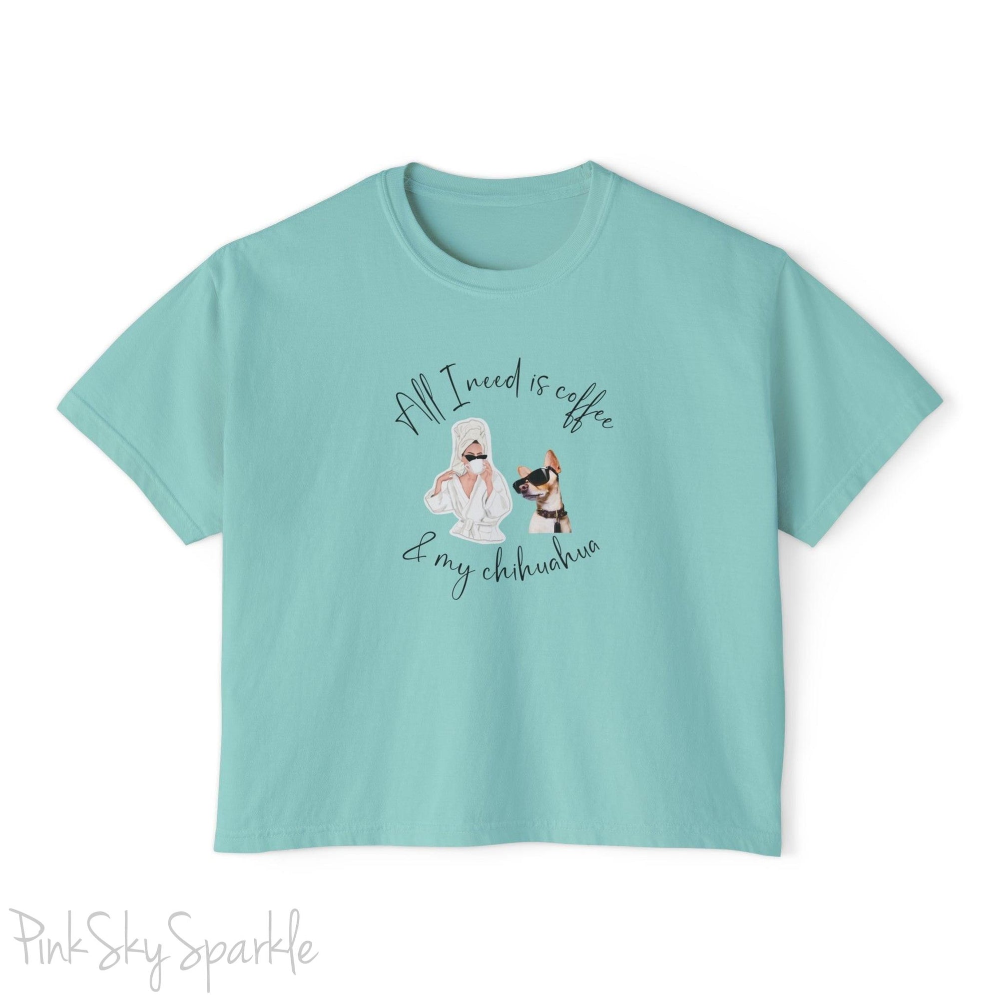 "All I need is coffee and my chihuahua" Women's Boxy Tee. Featuring a graphic of a woman wearing a robe and hair towel, wearing black sunglasses drinking a coffee next to a chihuahua wearing black sunglasses.