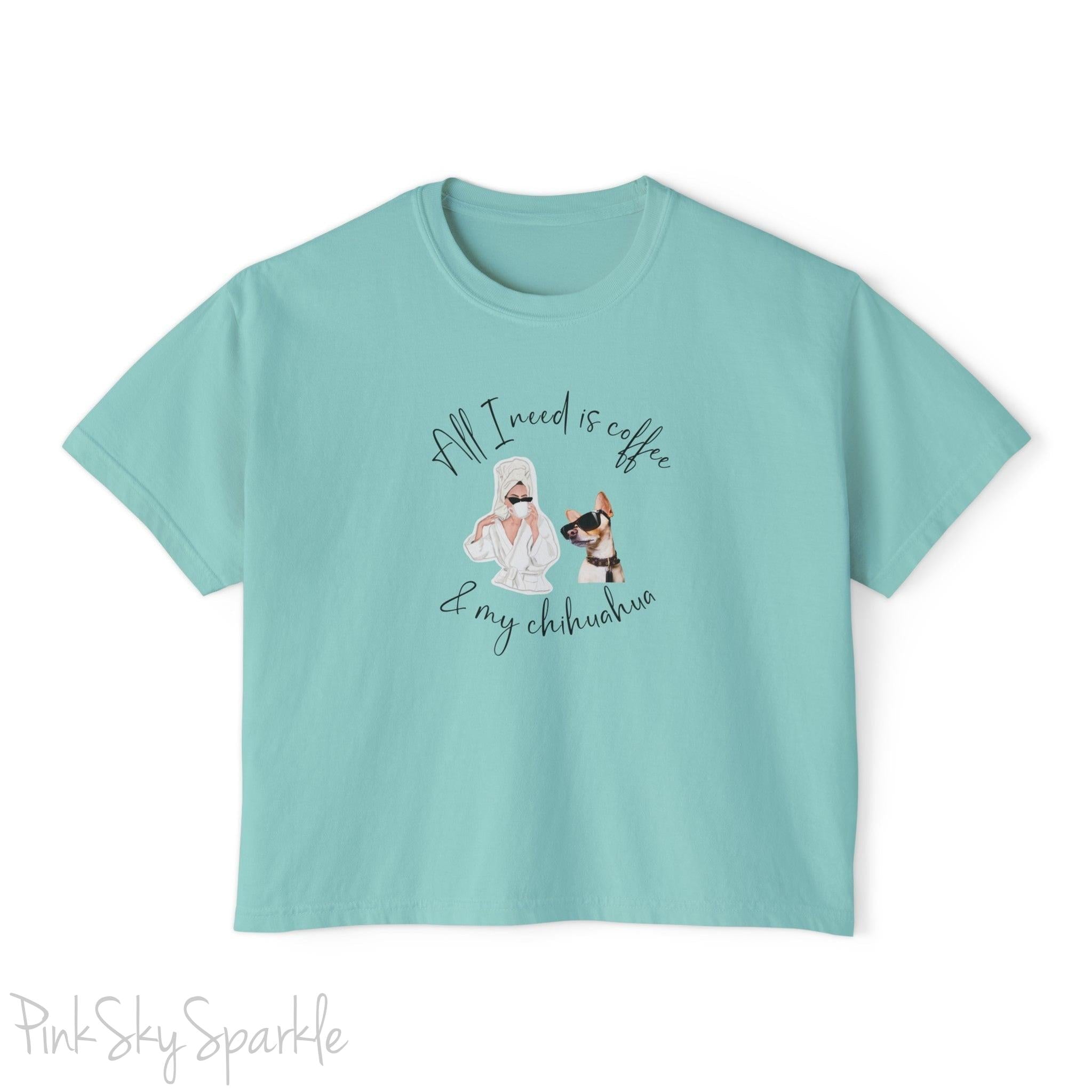 "All I need is coffee and my chihuahua" Women's Boxy Tee. Featuring a graphic of a woman wearing a robe and hair towel, wearing black sunglasses drinking a coffee next to a chihuahua wearing black sunglasses.