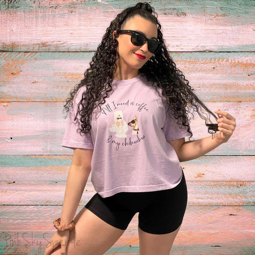 "All I need is coffee and my chihuahua" Women's Boxy Tee. Featuring a graphic of a woman wearing a robe and hair towel, wearing black sunglasses drinking a coffee next to a chihuahua wearing black sunglasses.