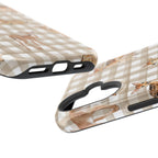 Two phone cases with checkered and deer print designs on a white background