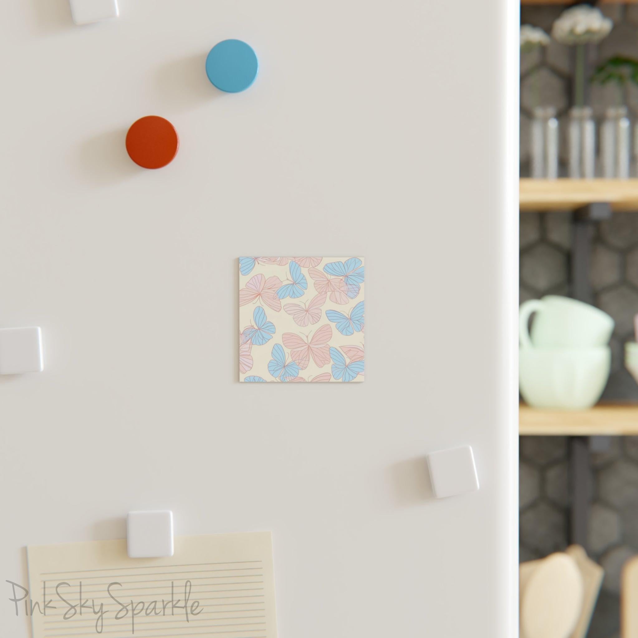 Beautiful Pink and Blue Butterfly Square Magnet with a neutral ivory coloured background. Can be used on the refrigerator or any magnetic surface.
