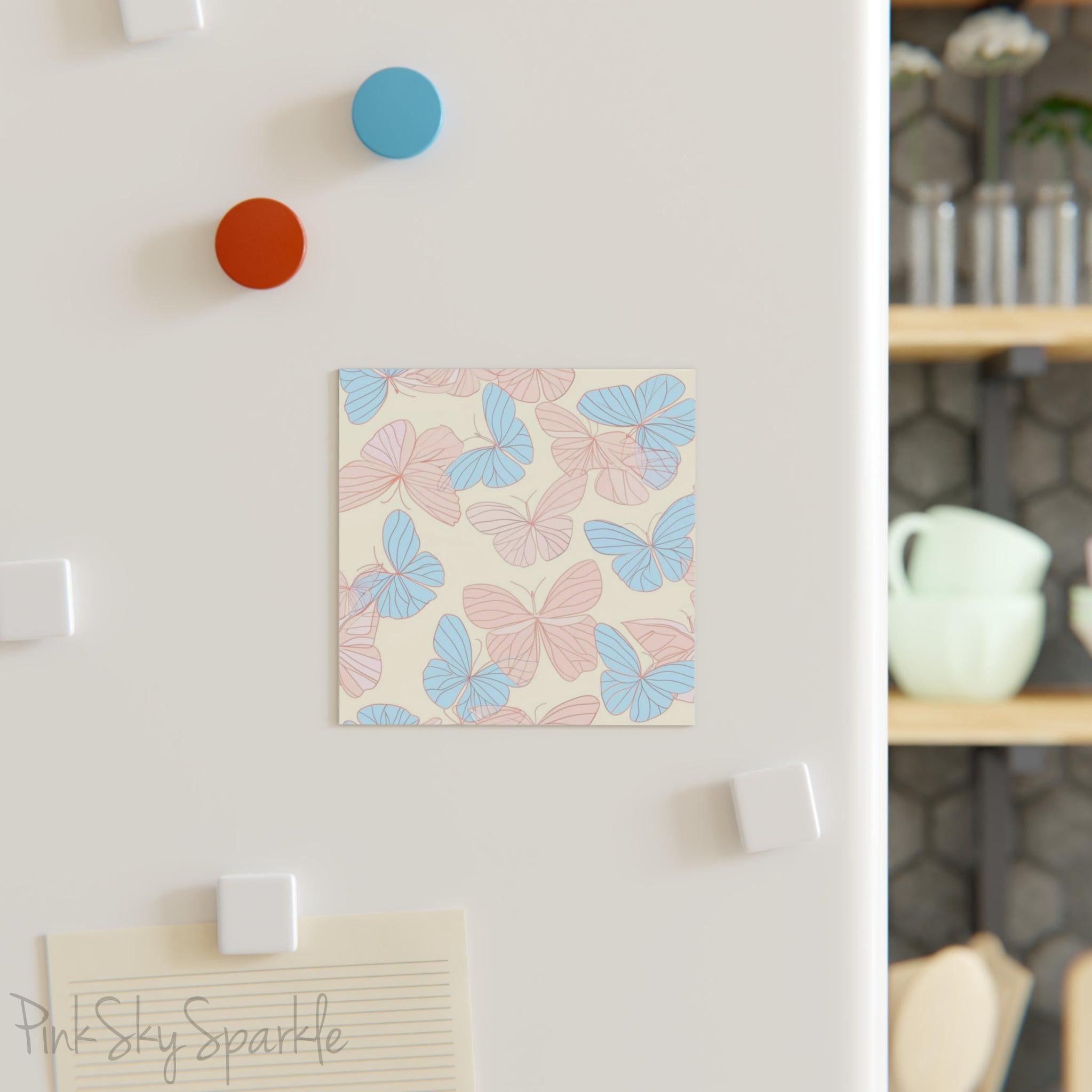 Beautiful Pink and Blue Butterfly Square Magnet with a neutral ivory coloured background. Can be used on the refrigerator or any magnetic surface.