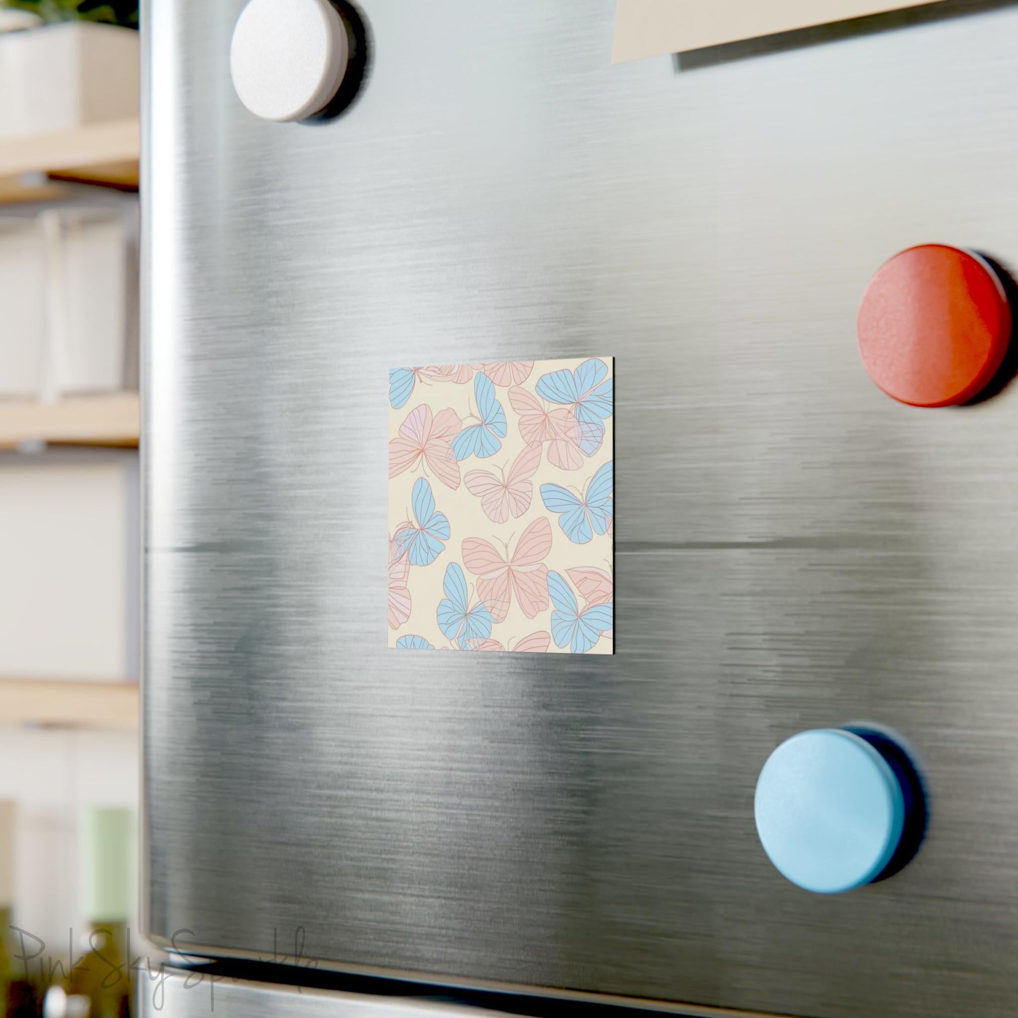 Beautiful Pink and Blue Butterfly Square Magnet with a neutral ivory coloured background. Can be used on the refrigerator or any magnetic surface.