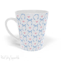 Blue Coquette 12oz Latte Mug,  featuring a light blue gingham print with delicate blue bows and pink hearts, this cute and stylish mug is perfect for your favourite coffee, tea, or hot cocoa. 