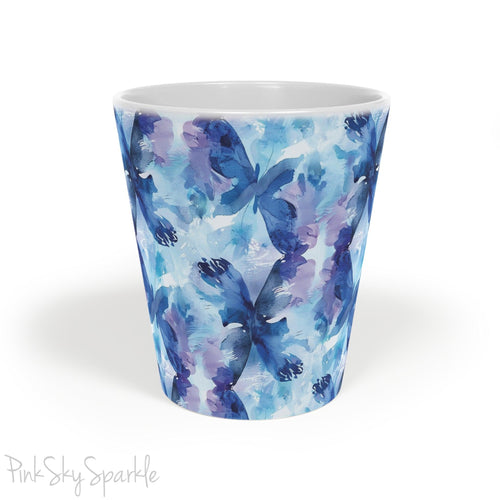A beautiful 12oz latte mug with a blue and purple abstract watercolor butterfly design.