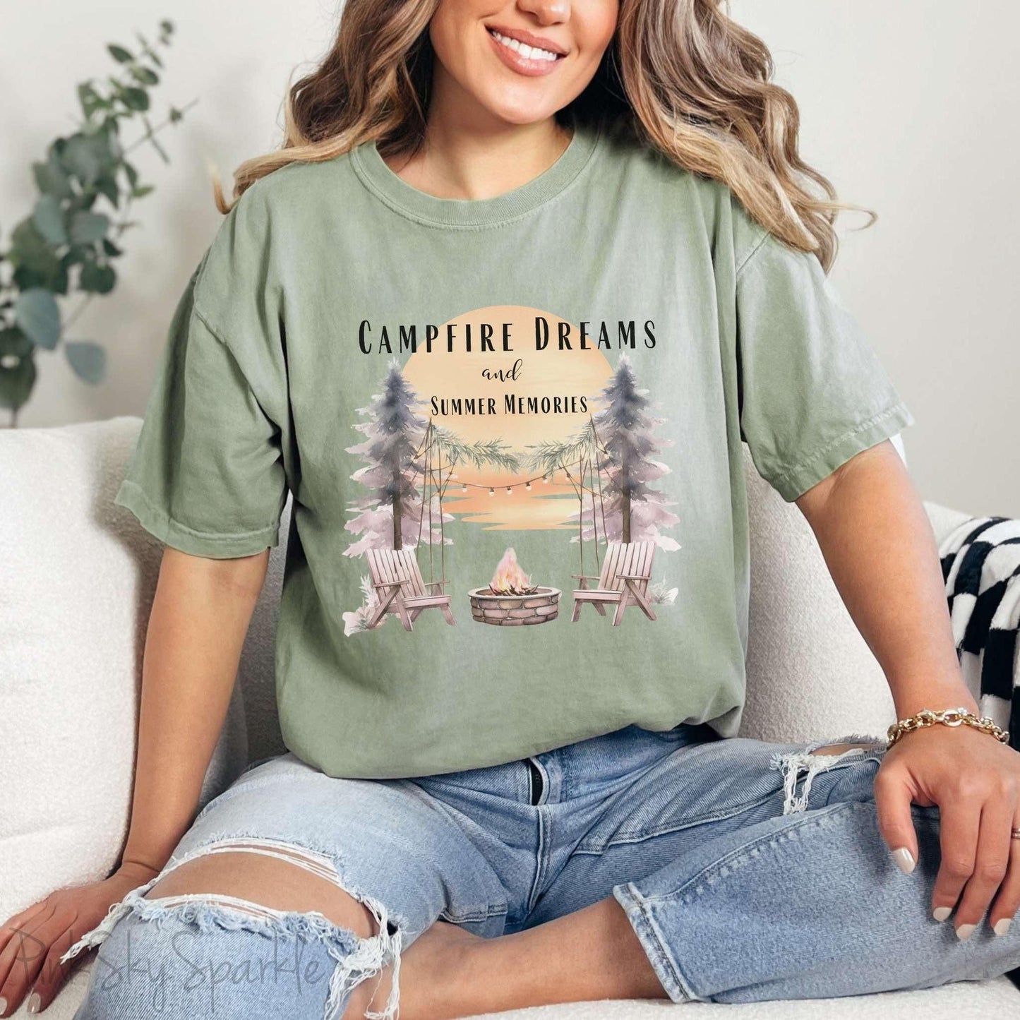 Campfire Dreams and Summer Memories Unisex Garment-Dyed T-shirt. Escape to the great outdoors with our Campfire Dreams and Summer Memories Garment-Dyed T-shirt. Made from soft, high-quality fabric, this shirt is perfect for cozy nights by the fire or creating unforgettable summer memories. Featuring the graphics of a scenery of a sunset, trees, patio lights, a fire pit and two wood chairs.