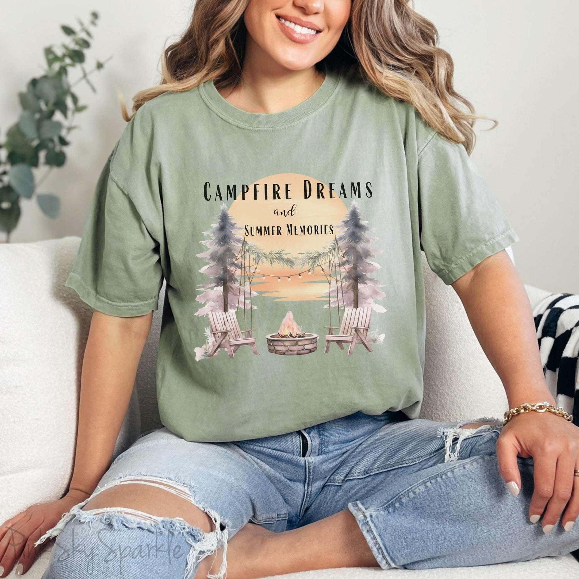 Campfire Dreams and Summer Memories Unisex Garment-Dyed T-shirt. Escape to the great outdoors with our Campfire Dreams and Summer Memories Garment-Dyed T-shirt. Made from soft, high-quality fabric, this shirt is perfect for cozy nights by the fire or creating unforgettable summer memories. Featuring the graphics of a scenery of a sunset, trees, patio lights, a fire pit and two wood chairs.