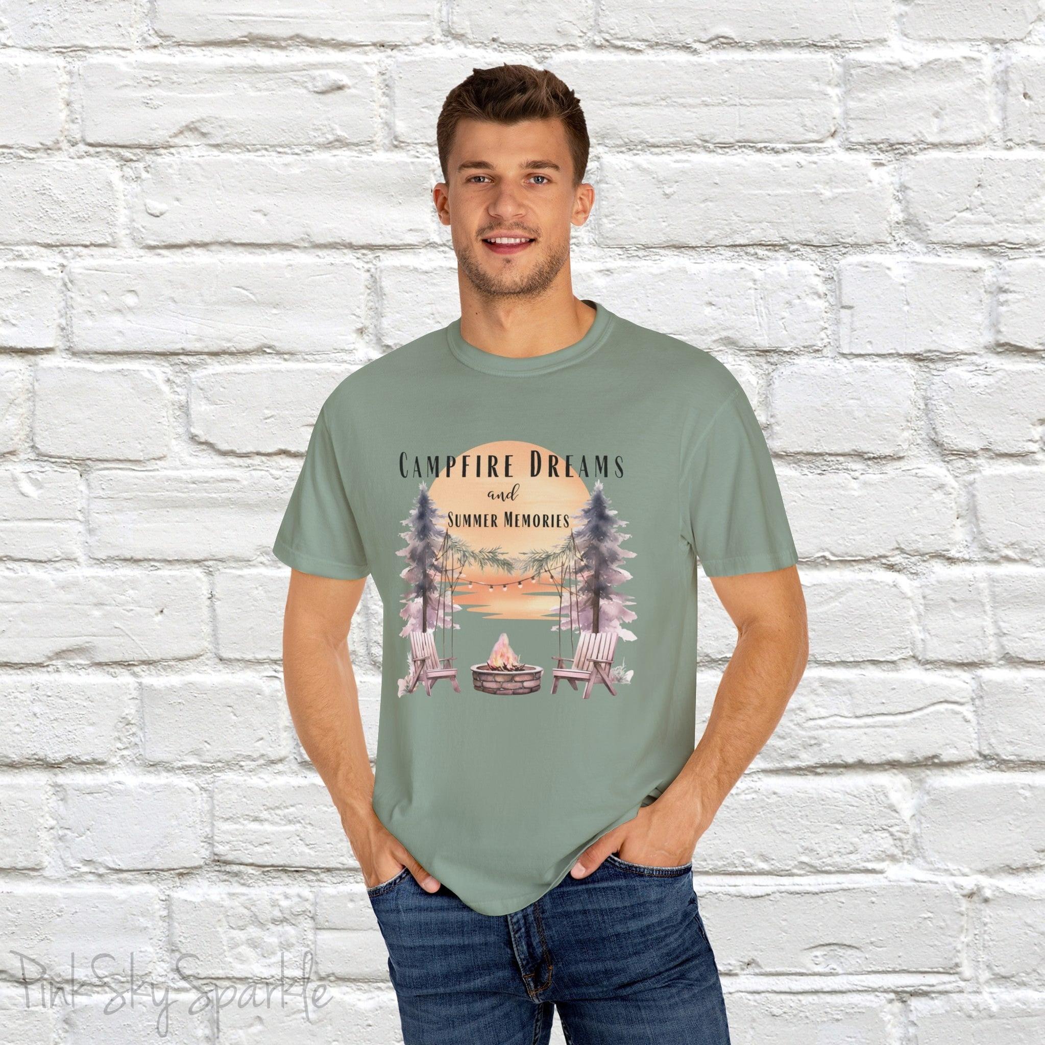 Campfire Dreams and Summer Memories Unisex Garment-Dyed T-shirt. Escape to the great outdoors with our Campfire Dreams and Summer Memories Garment-Dyed T-shirt. Made from soft, high-quality fabric, this shirt is perfect for cozy nights by the fire or creating unforgettable summer memories. Featuring the graphics of a scenery of a sunset, trees, patio lights, a fire pit and two wood chairs.