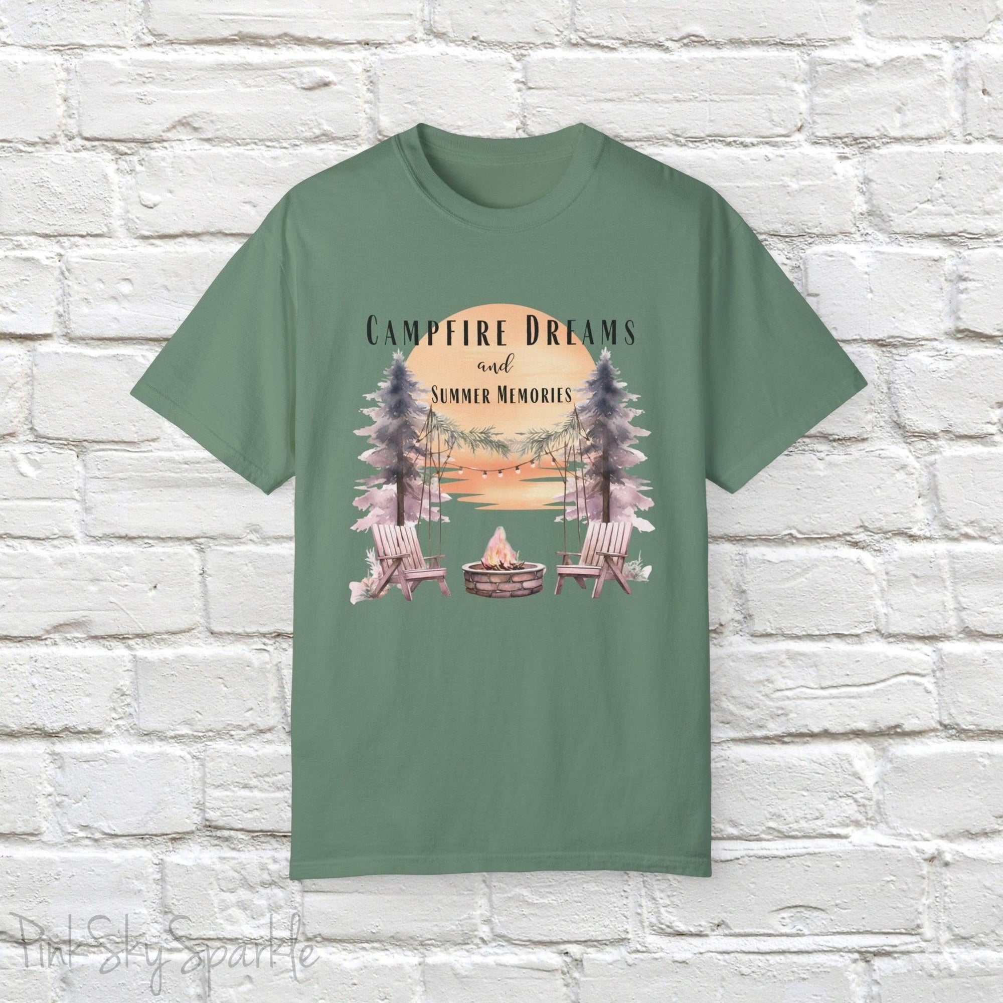 Campfire Dreams and Summer Memories Unisex Garment-Dyed T-shirt. Escape to the great outdoors with our Campfire Dreams and Summer Memories Garment-Dyed T-shirt. Made from soft, high-quality fabric, this shirt is perfect for cozy nights by the fire or creating unforgettable summer memories. Featuring the graphics of a scenery of a sunset, trees, patio lights, a fire pit and two wood chairs.