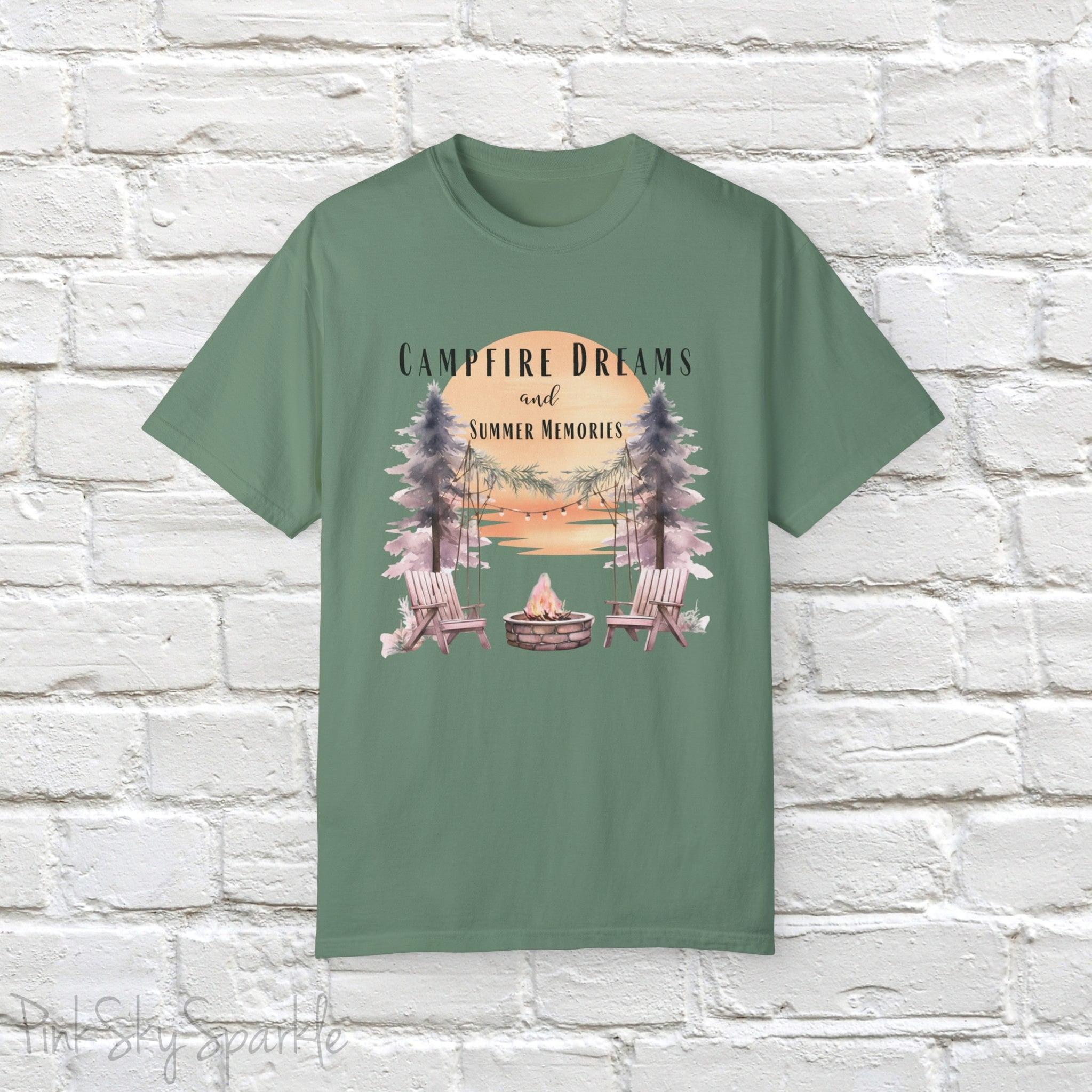Campfire Dreams and Summer Memories Unisex Garment-Dyed T-shirt. Escape to the great outdoors with our Campfire Dreams and Summer Memories Garment-Dyed T-shirt. Made from soft, high-quality fabric, this shirt is perfect for cozy nights by the fire or creating unforgettable summer memories. Featuring the graphics of a scenery of a sunset, trees, patio lights, a fire pit and two wood chairs.