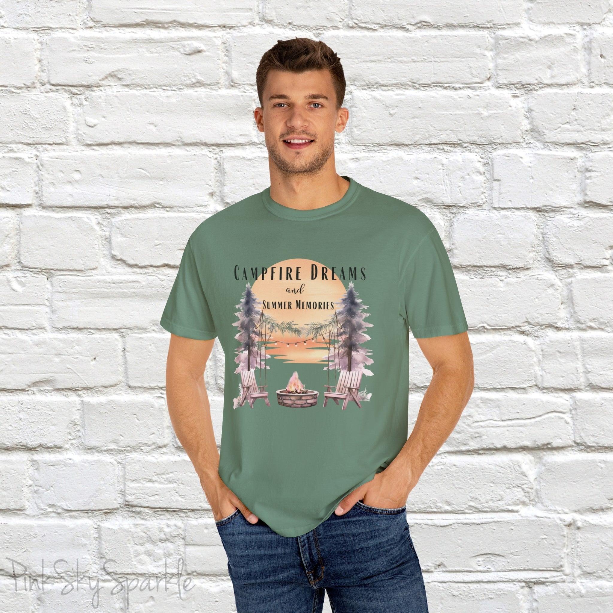 Campfire Dreams and Summer Memories Unisex Garment-Dyed T-shirt. Escape to the great outdoors with our Campfire Dreams and Summer Memories Garment-Dyed T-shirt. Made from soft, high-quality fabric, this shirt is perfect for cozy nights by the fire or creating unforgettable summer memories. Featuring the graphics of a scenery of a sunset, trees, patio lights, a fire pit and two wood chairs.
