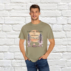 Campfire Dreams and Summer Memories Unisex Garment-Dyed T-shirt. Escape to the great outdoors with our Campfire Dreams and Summer Memories Garment-Dyed T-shirt. Made from soft, high-quality fabric, this shirt is perfect for cozy nights by the fire or creating unforgettable summer memories. Featuring the graphics of a scenery of a sunset, trees, patio lights, a fire pit and two wood chairs.