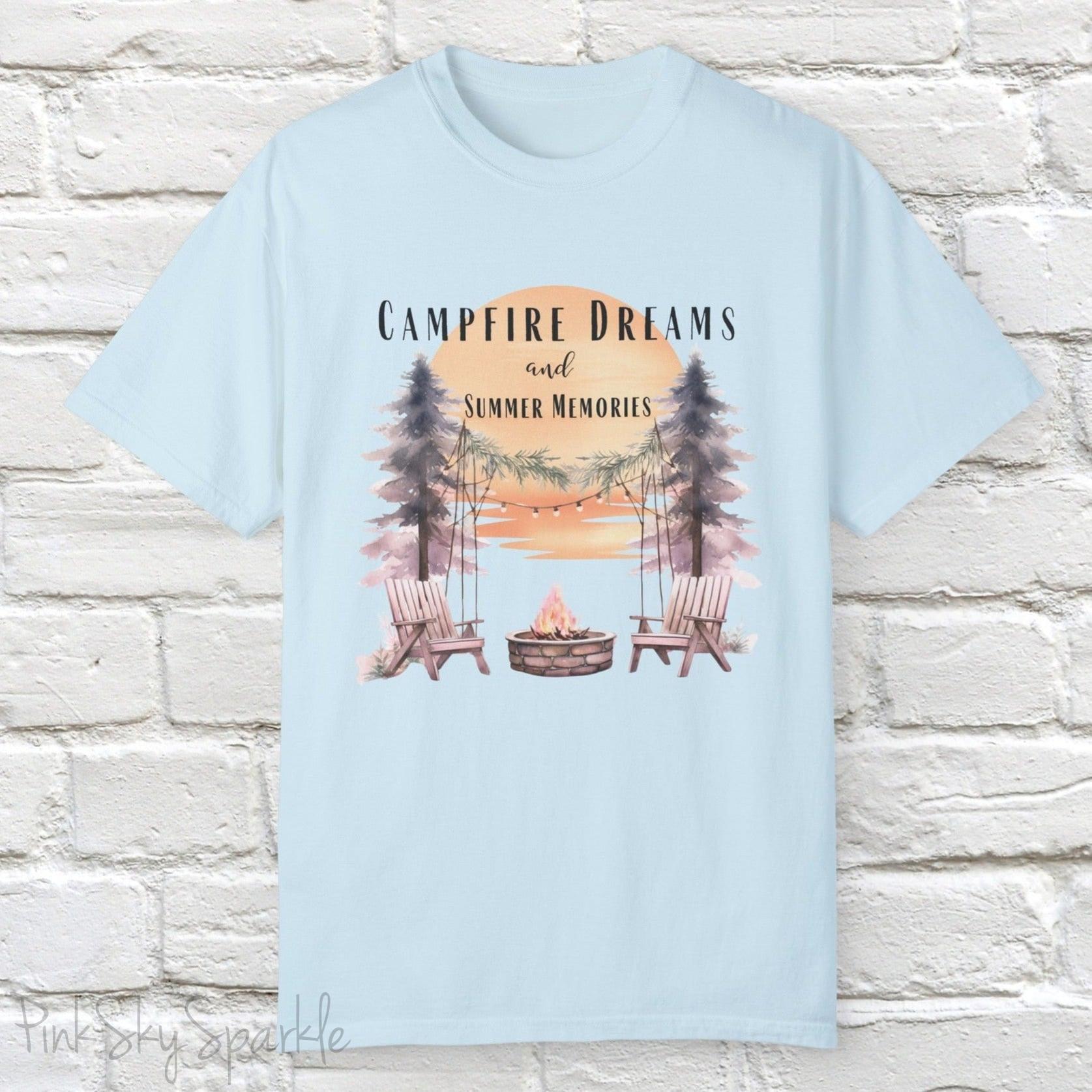 Campfire Dreams and Summer Memories Unisex Garment-Dyed T-shirt. Escape to the great outdoors with our Campfire Dreams and Summer Memories Garment-Dyed T-shirt. Made from soft, high-quality fabric, this shirt is perfect for cozy nights by the fire or creating unforgettable summer memories. Featuring the graphics of a scenery of a sunset, trees, patio lights, a fire pit and two wood chairs.