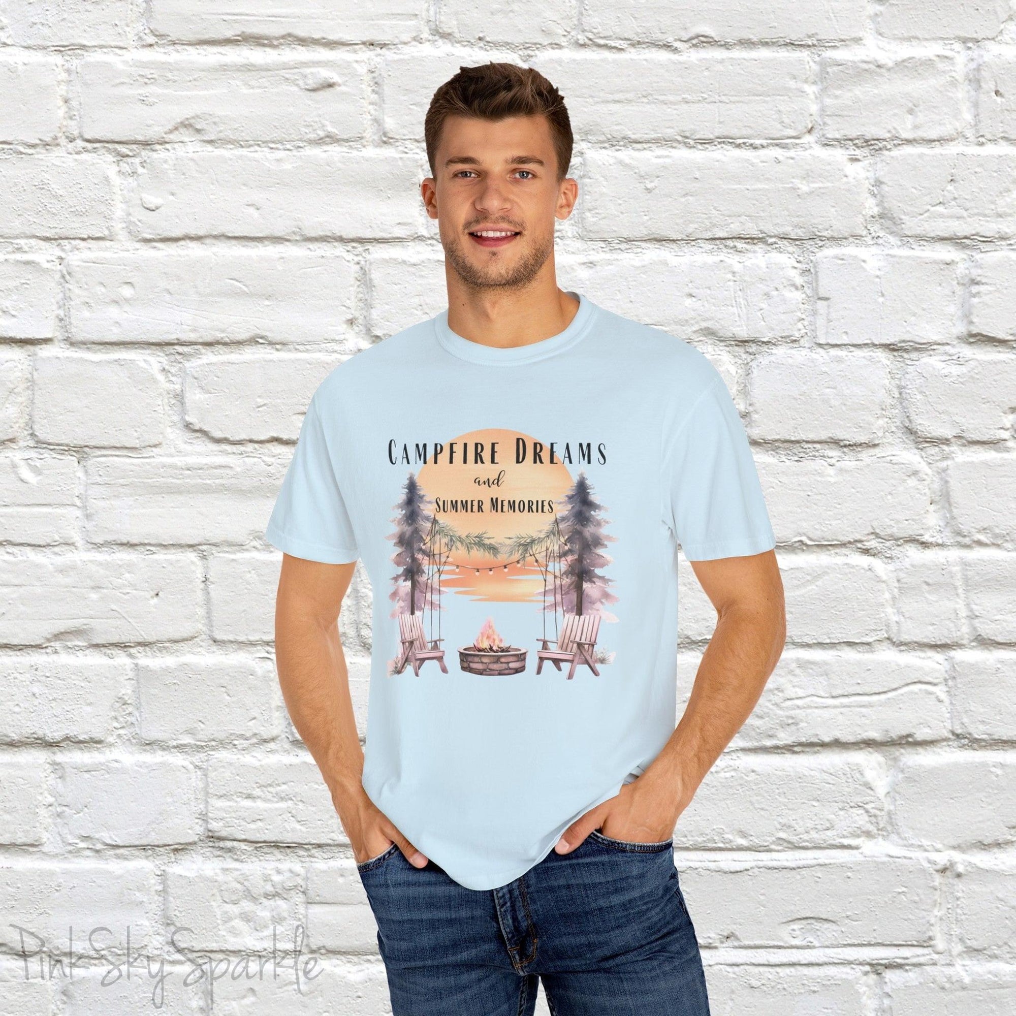 Campfire Dreams and Summer Memories Unisex Garment-Dyed T-shirt. Escape to the great outdoors with our Campfire Dreams and Summer Memories Garment-Dyed T-shirt. Made from soft, high-quality fabric, this shirt is perfect for cozy nights by the fire or creating unforgettable summer memories. Featuring the graphics of a scenery of a sunset, trees, patio lights, a fire pit and two wood chairs.