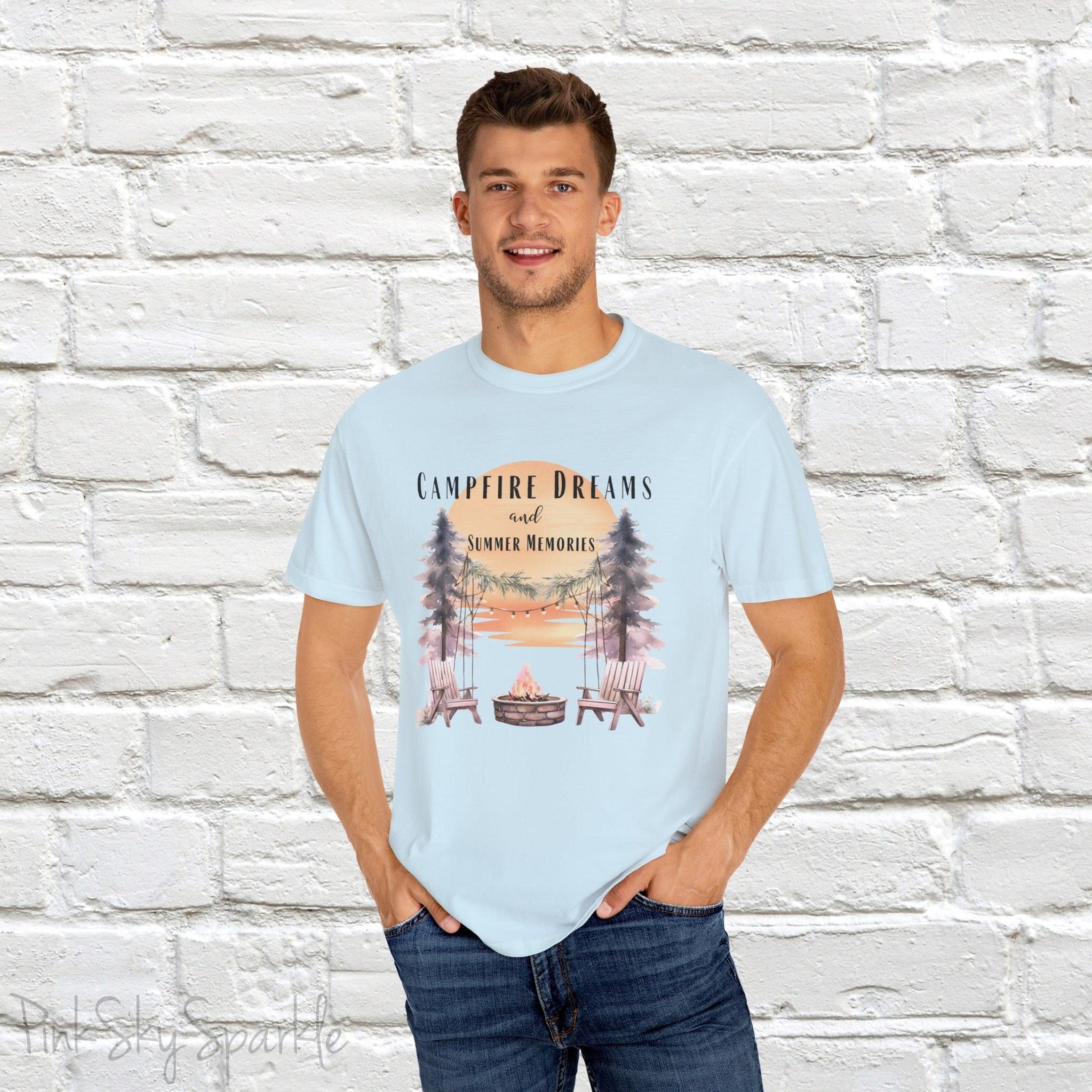 Campfire Dreams and Summer Memories Unisex Garment-Dyed T-shirt. Escape to the great outdoors with our Campfire Dreams and Summer Memories Garment-Dyed T-shirt. Made from soft, high-quality fabric, this shirt is perfect for cozy nights by the fire or creating unforgettable summer memories. Featuring the graphics of a scenery of a sunset, trees, patio lights, a fire pit and two wood chairs.