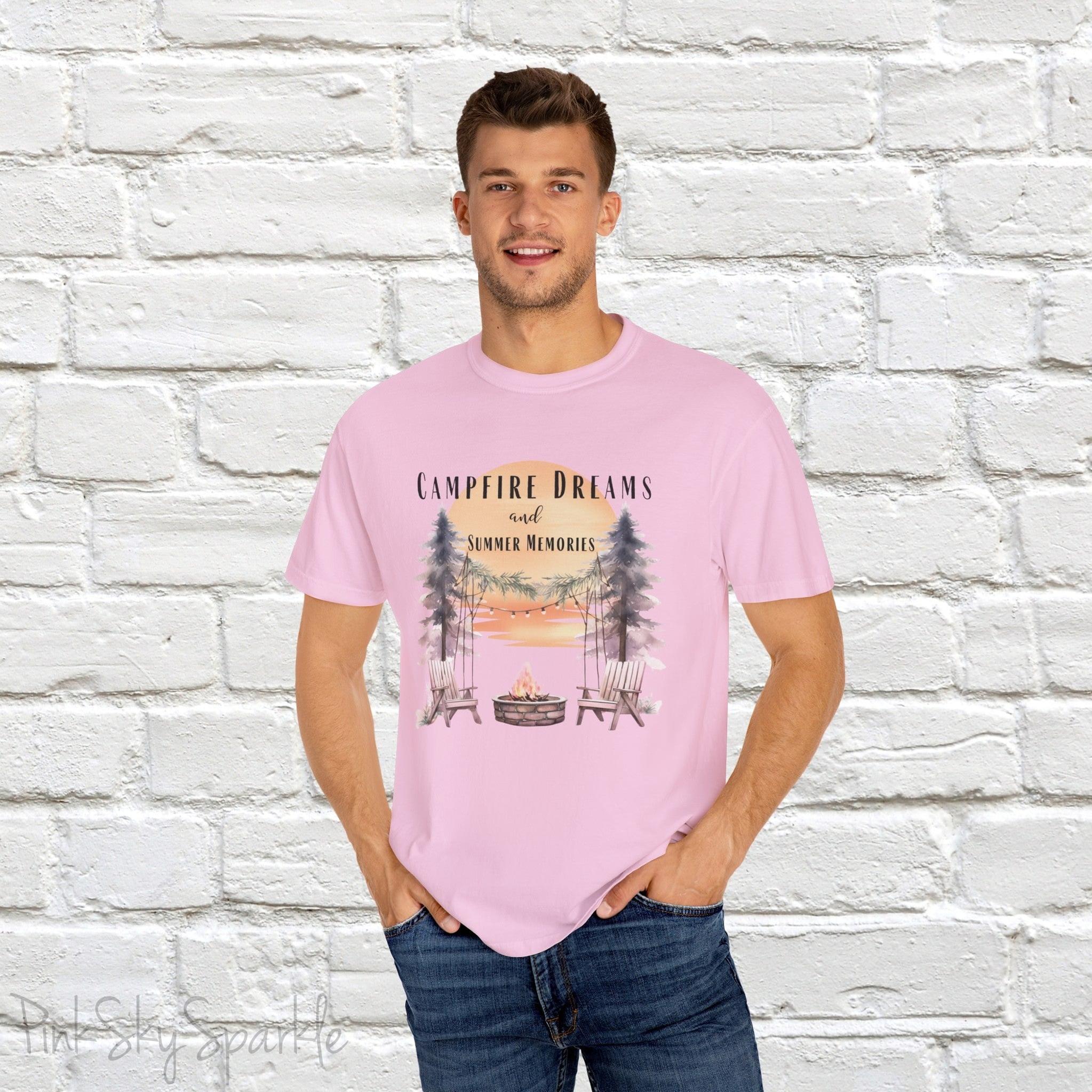 Campfire Dreams and Summer Memories Unisex Garment-Dyed T-shirt. Escape to the great outdoors with our Campfire Dreams and Summer Memories Garment-Dyed T-shirt. Made from soft, high-quality fabric, this shirt is perfect for cozy nights by the fire or creating unforgettable summer memories. Featuring the graphics of a scenery of a sunset, trees, patio lights, a fire pit and two wood chairs.