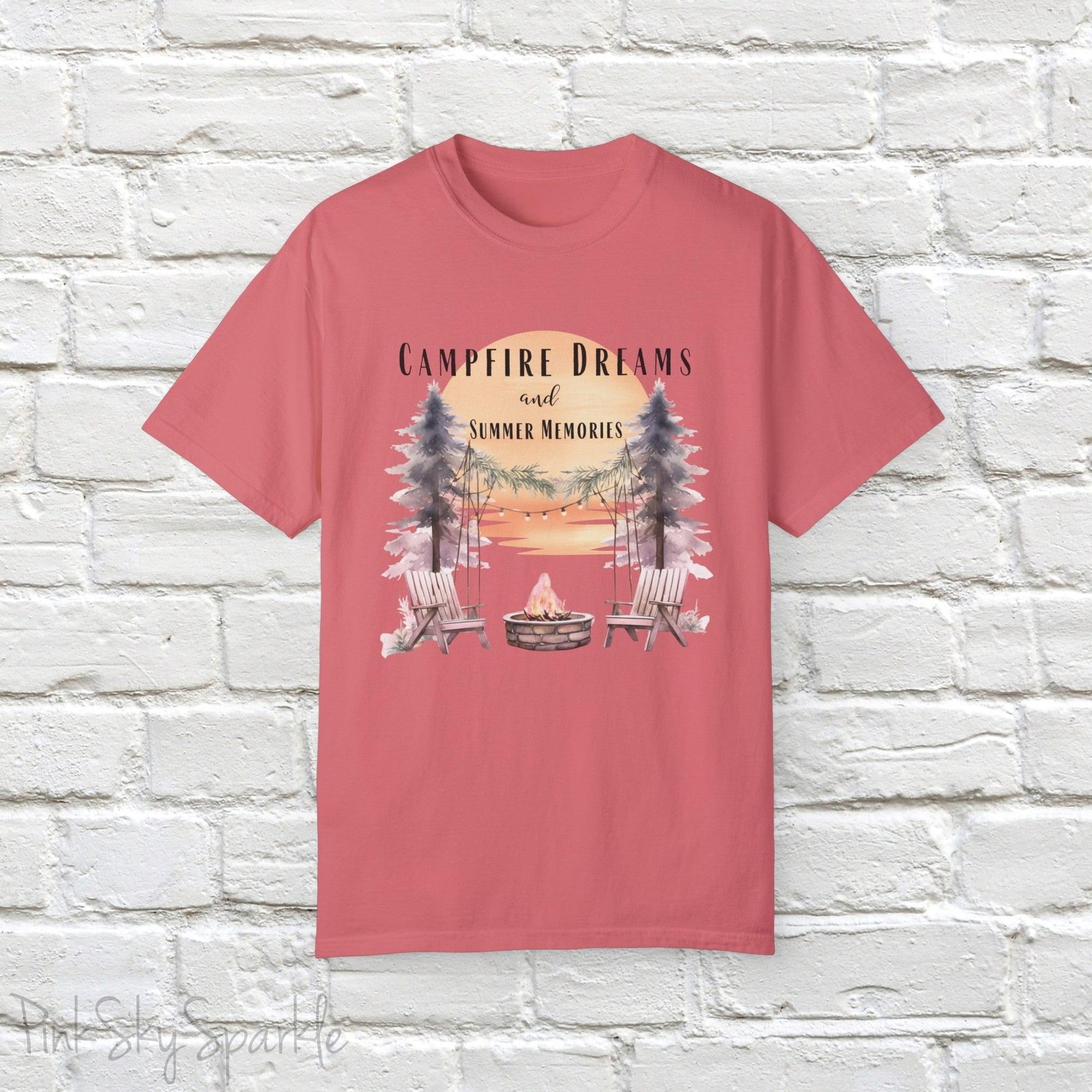 Campfire Dreams and Summer Memories Unisex Garment-Dyed T-shirt. Escape to the great outdoors with our Campfire Dreams and Summer Memories Garment-Dyed T-shirt. Made from soft, high-quality fabric, this shirt is perfect for cozy nights by the fire or creating unforgettable summer memories. Featuring the graphics of a scenery of a sunset, trees, patio lights, a fire pit and two wood chairs.