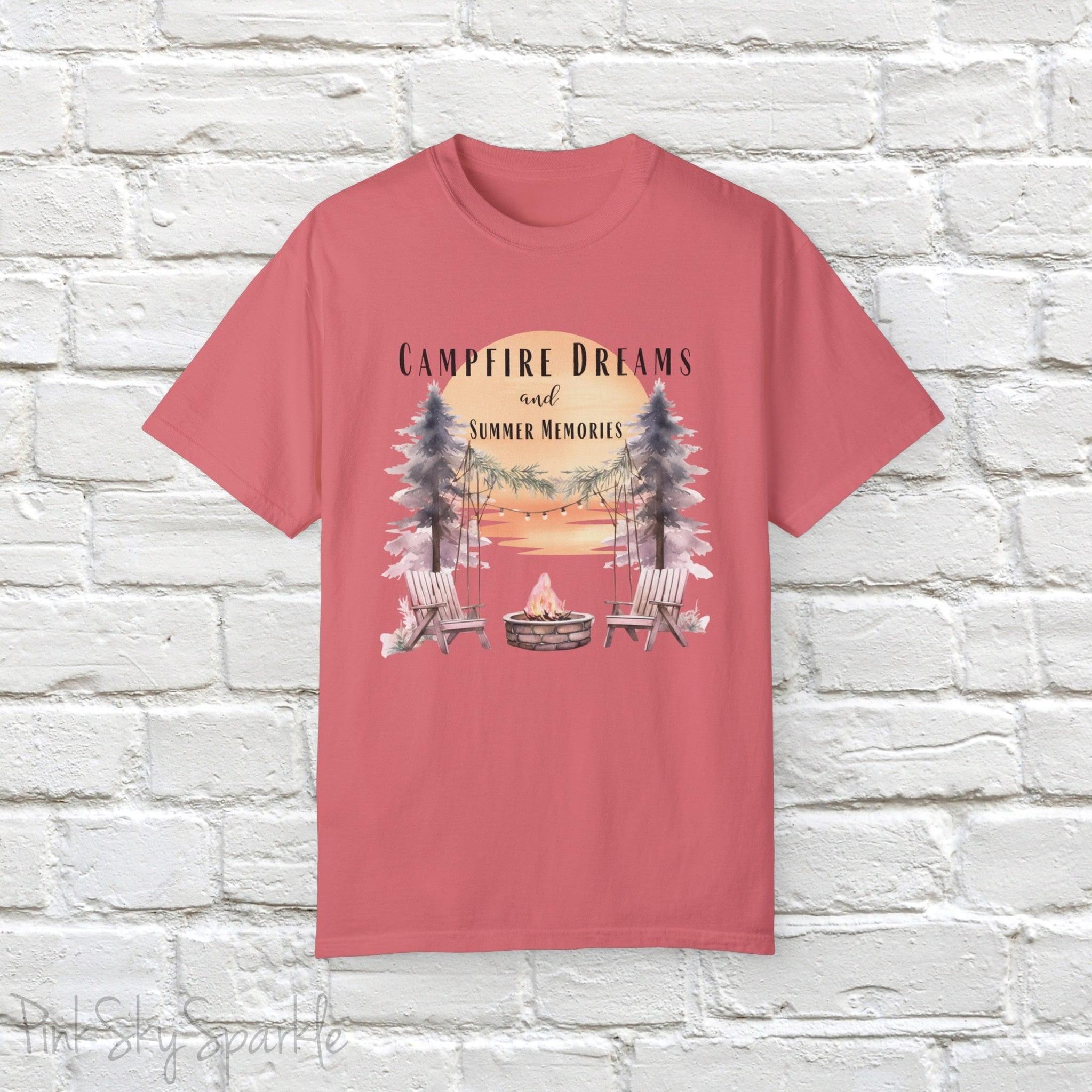 Campfire Dreams and Summer Memories Unisex Garment-Dyed T-shirt. Escape to the great outdoors with our Campfire Dreams and Summer Memories Garment-Dyed T-shirt. Made from soft, high-quality fabric, this shirt is perfect for cozy nights by the fire or creating unforgettable summer memories. Featuring the graphics of a scenery of a sunset, trees, patio lights, a fire pit and two wood chairs.