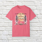 Campfire Dreams and Summer Memories Unisex Garment-Dyed T-shirt. Escape to the great outdoors with our Campfire Dreams and Summer Memories Garment-Dyed T-shirt. Made from soft, high-quality fabric, this shirt is perfect for cozy nights by the fire or creating unforgettable summer memories. Featuring the graphics of a scenery of a sunset, trees, patio lights, a fire pit and two wood chairs.
