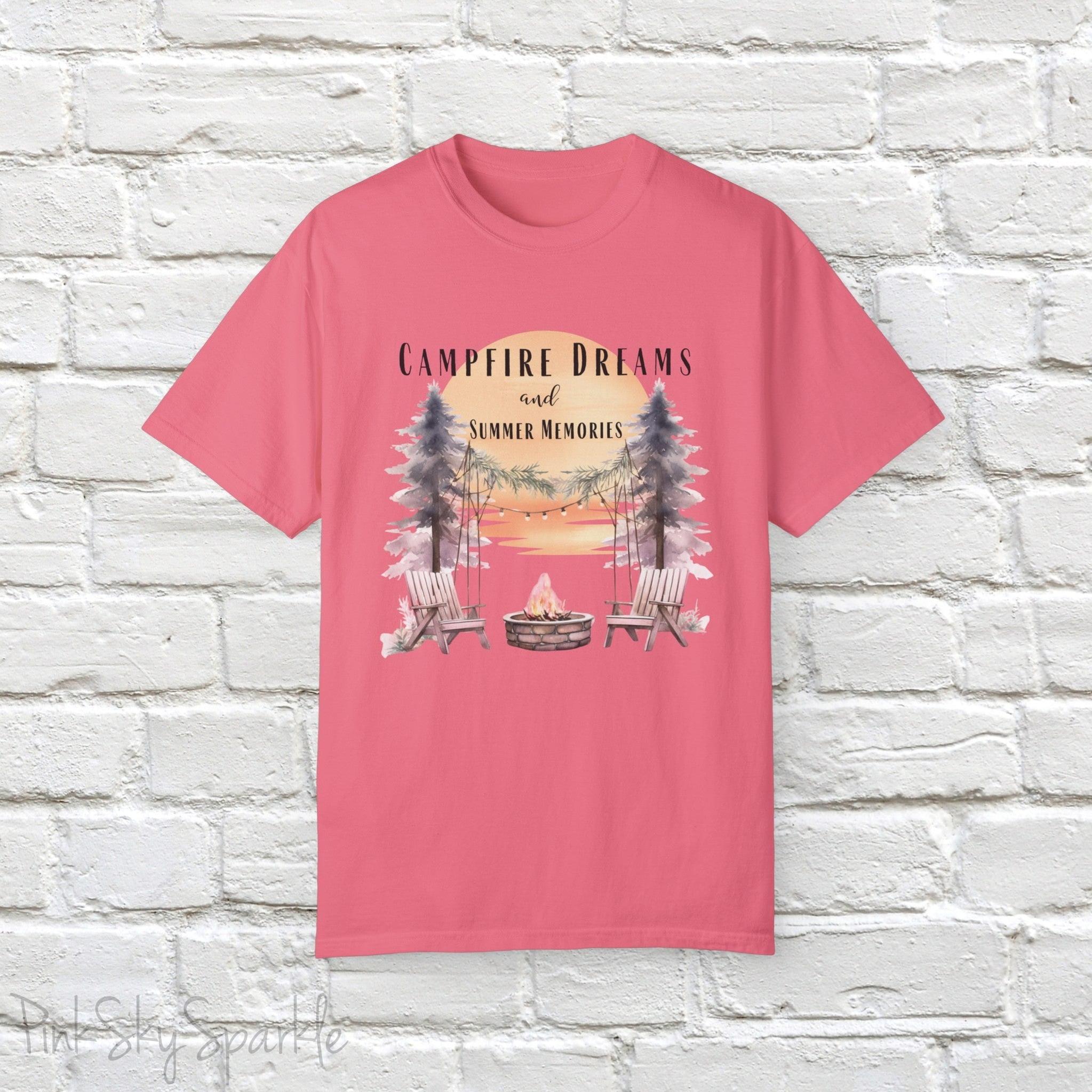 Campfire Dreams and Summer Memories Unisex Garment-Dyed T-shirt. Escape to the great outdoors with our Campfire Dreams and Summer Memories Garment-Dyed T-shirt. Made from soft, high-quality fabric, this shirt is perfect for cozy nights by the fire or creating unforgettable summer memories. Featuring the graphics of a scenery of a sunset, trees, patio lights, a fire pit and two wood chairs.